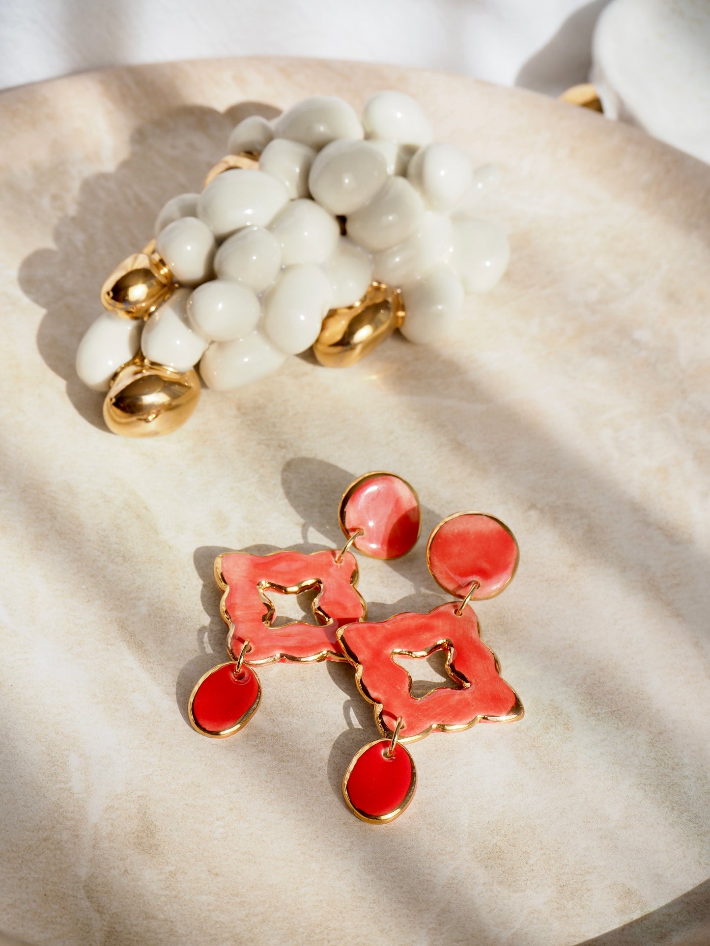 “A Feast for your Eyes” Handmade Porcelain Earrings in Warm Red coloured glaze with 24k gold lustre details.