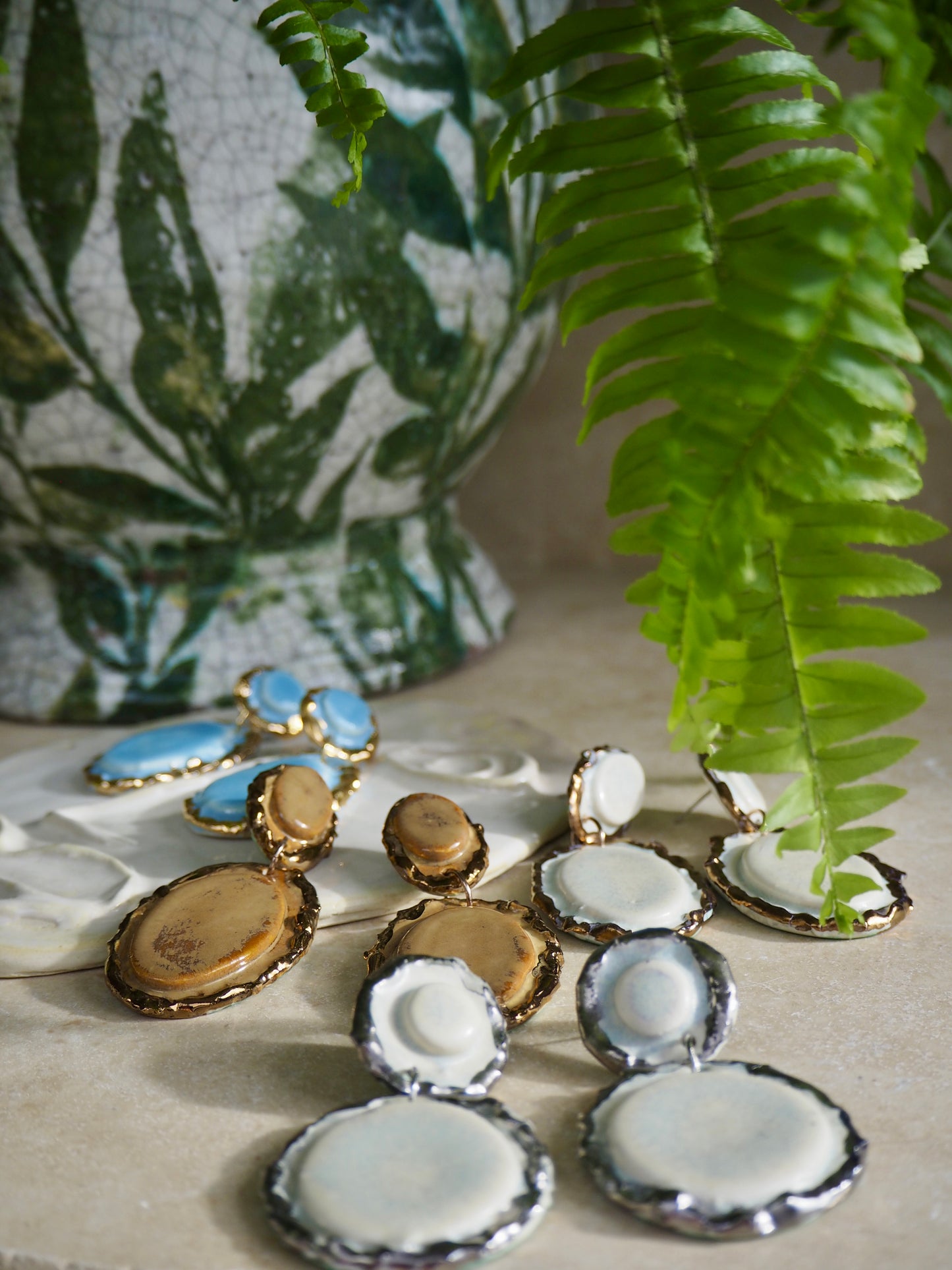 Femminilità Porcelain Earrings in “light Blue” coloured glossy glaze with 24k Gold lustre textured rims