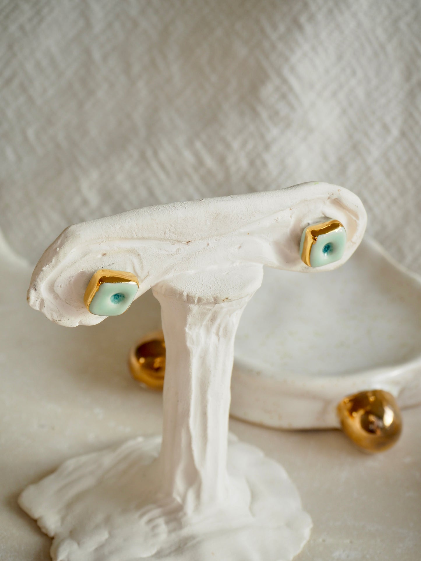 “il Quadrato” Small Handmade Porcelain Studs coloured with Shades of Aqua glossy glaze with 24k Gold lustre details