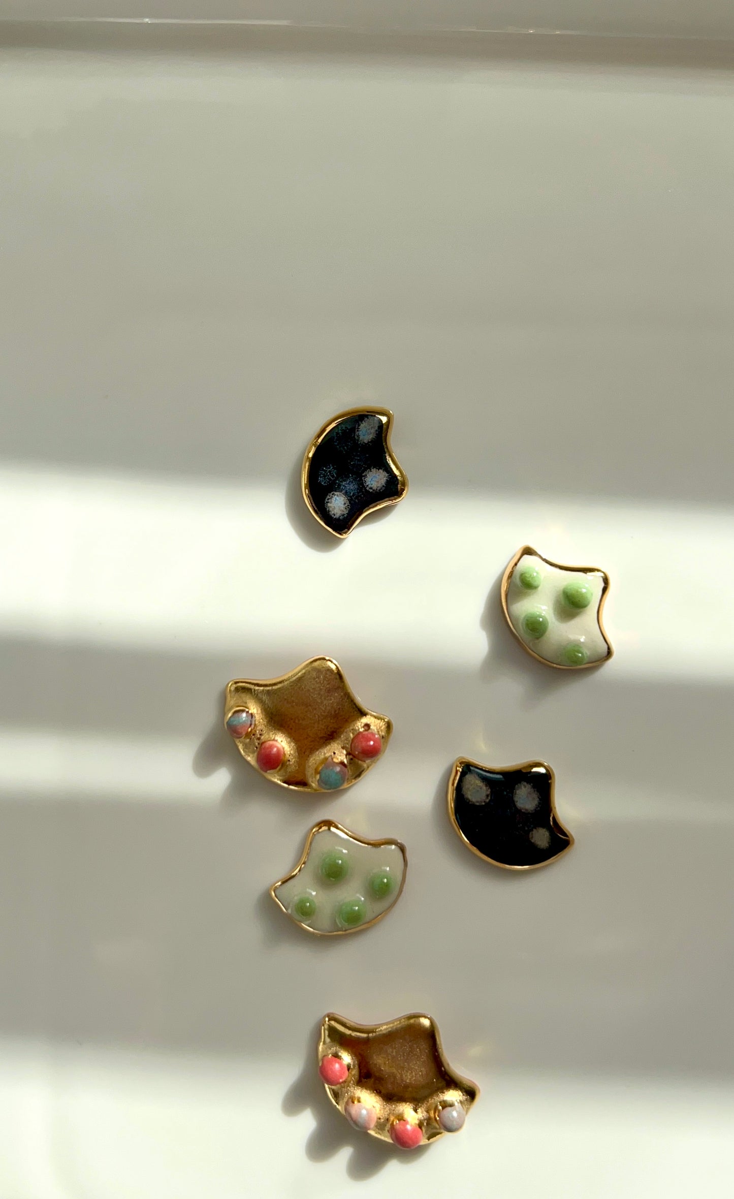 the Jocelyn collection “Conchiglia Black”handmade Porcelain Earrings with 24k gold lustre details