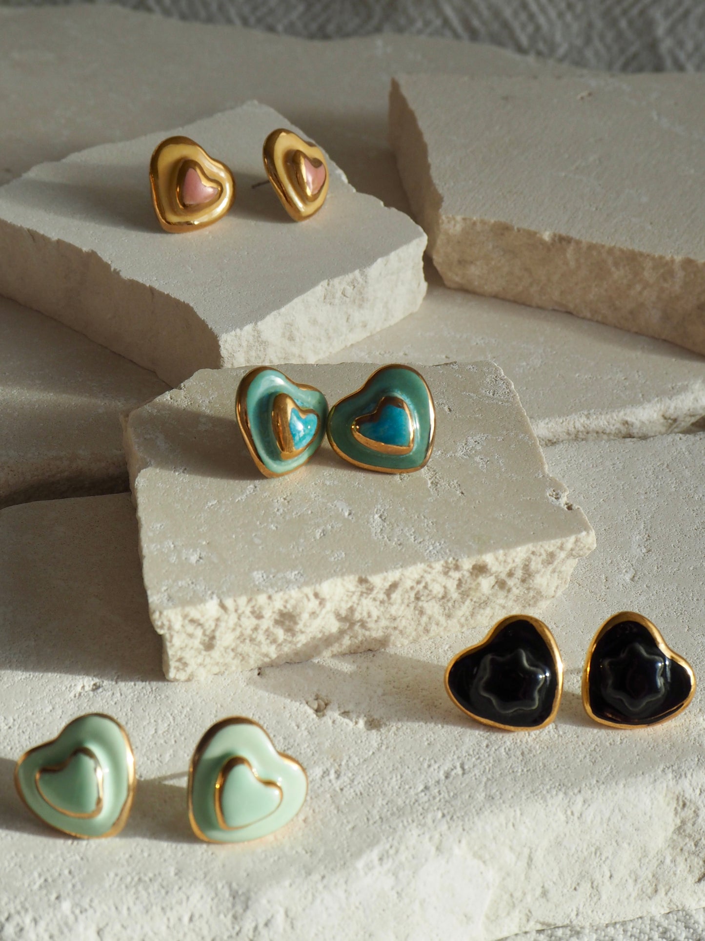Small Handmade Porcelain Heart Stud coloured with “Blues and Greens” glossy glazes with 24k Gold lustre details
