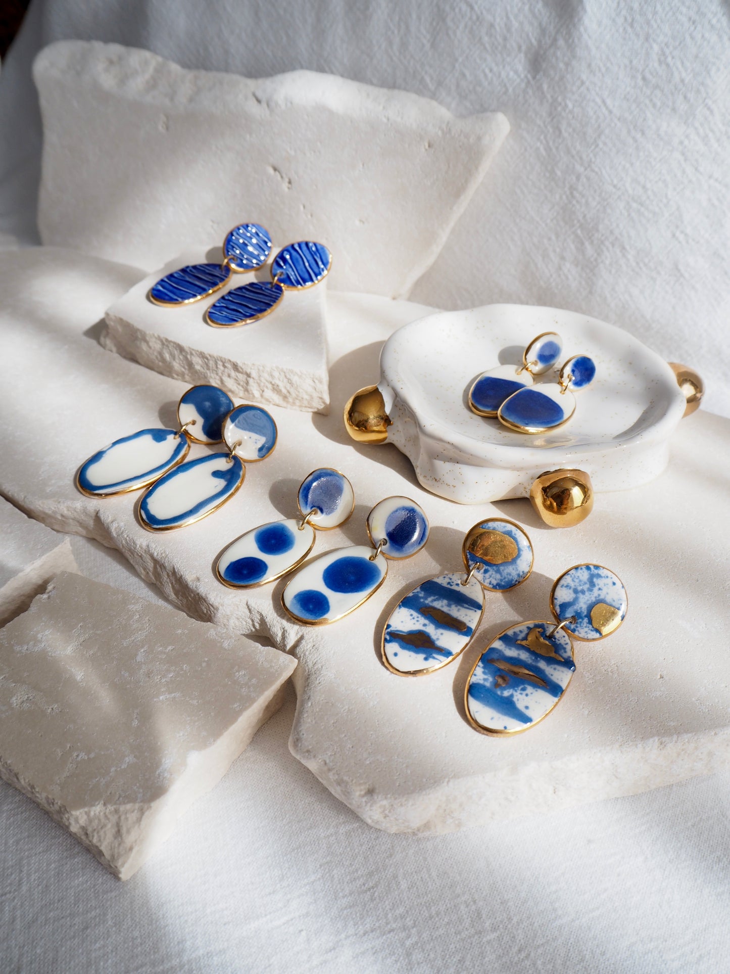 Royal Blue Dots & White Porcelain Earrings coloured using ceramic stain under clear glaze for glossy look