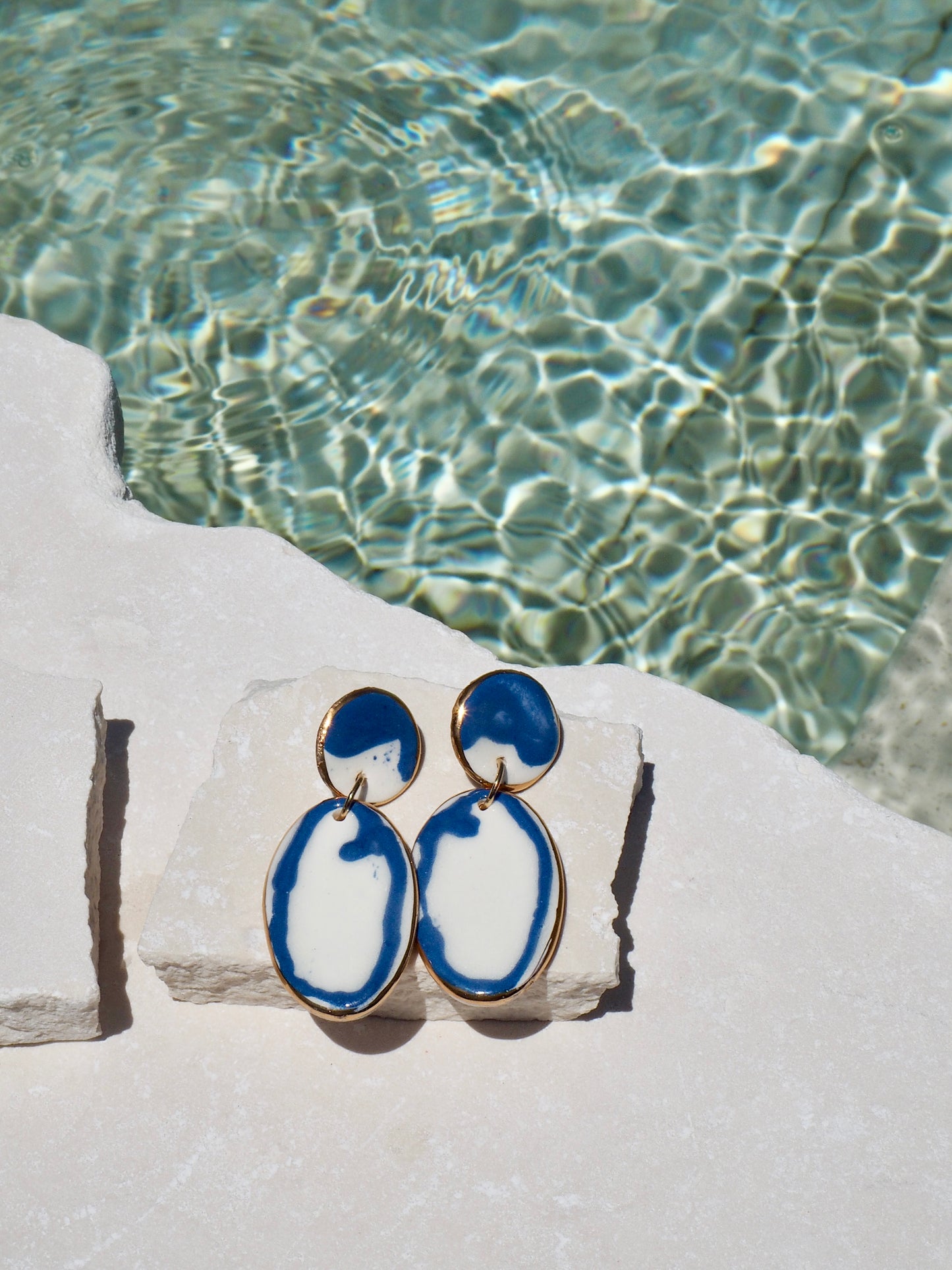 Royal Blue Rim & White Porcelain Earrings coloured using ceramic stain under clear glaze for glossy look
