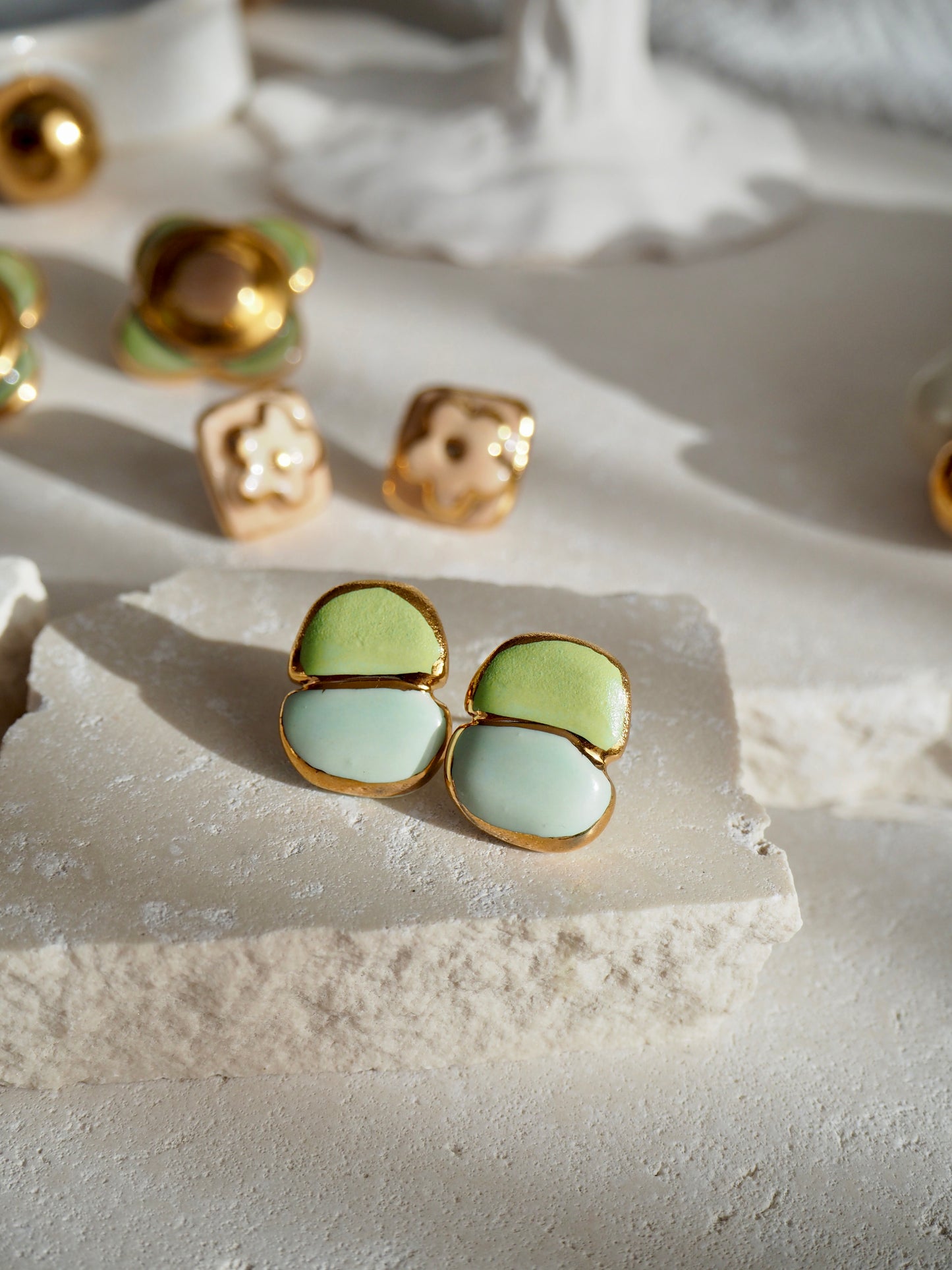 “il Quadrato Coccinella” Small Handmade Porcelain Studs coloured with Light Green&Blue matt glossy glazes with 24k Gold lustre details