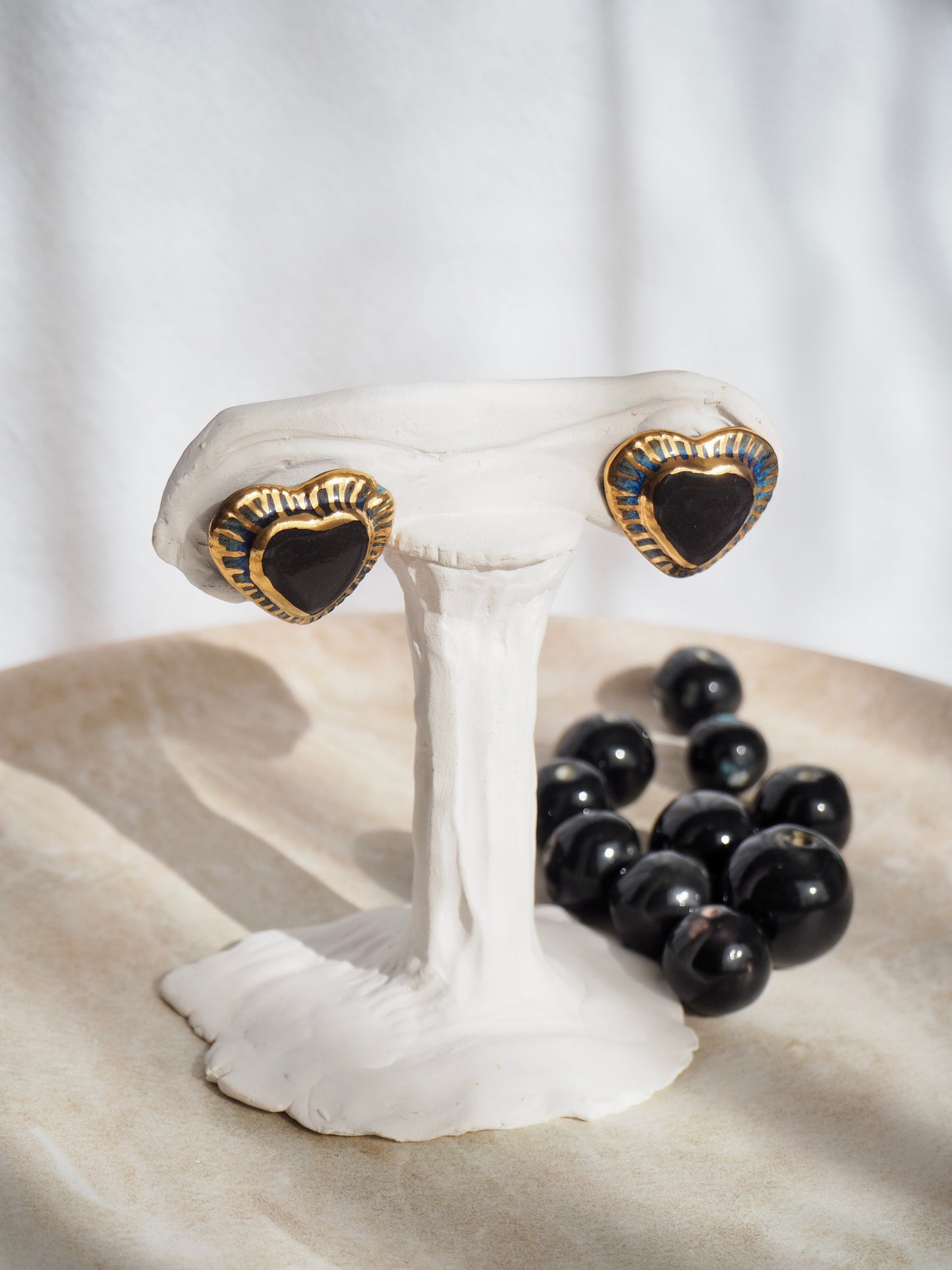 Black Clay Heart Earrings with blue glossy glazes & 24k Gold lustre rim