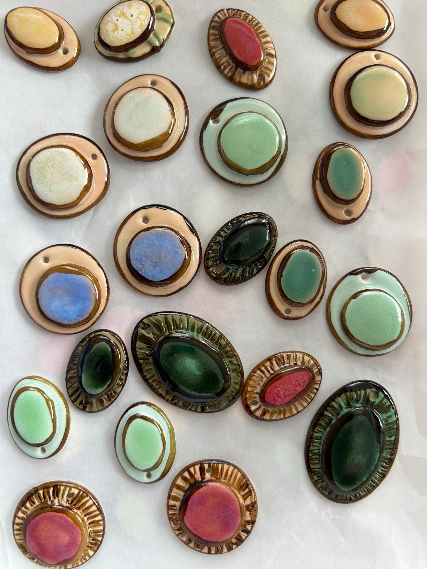 Femminilità Porcelain Earrings in Mint Green coloured glossy glaze on Parchment underglaze with 24k Gold lustre textured rims