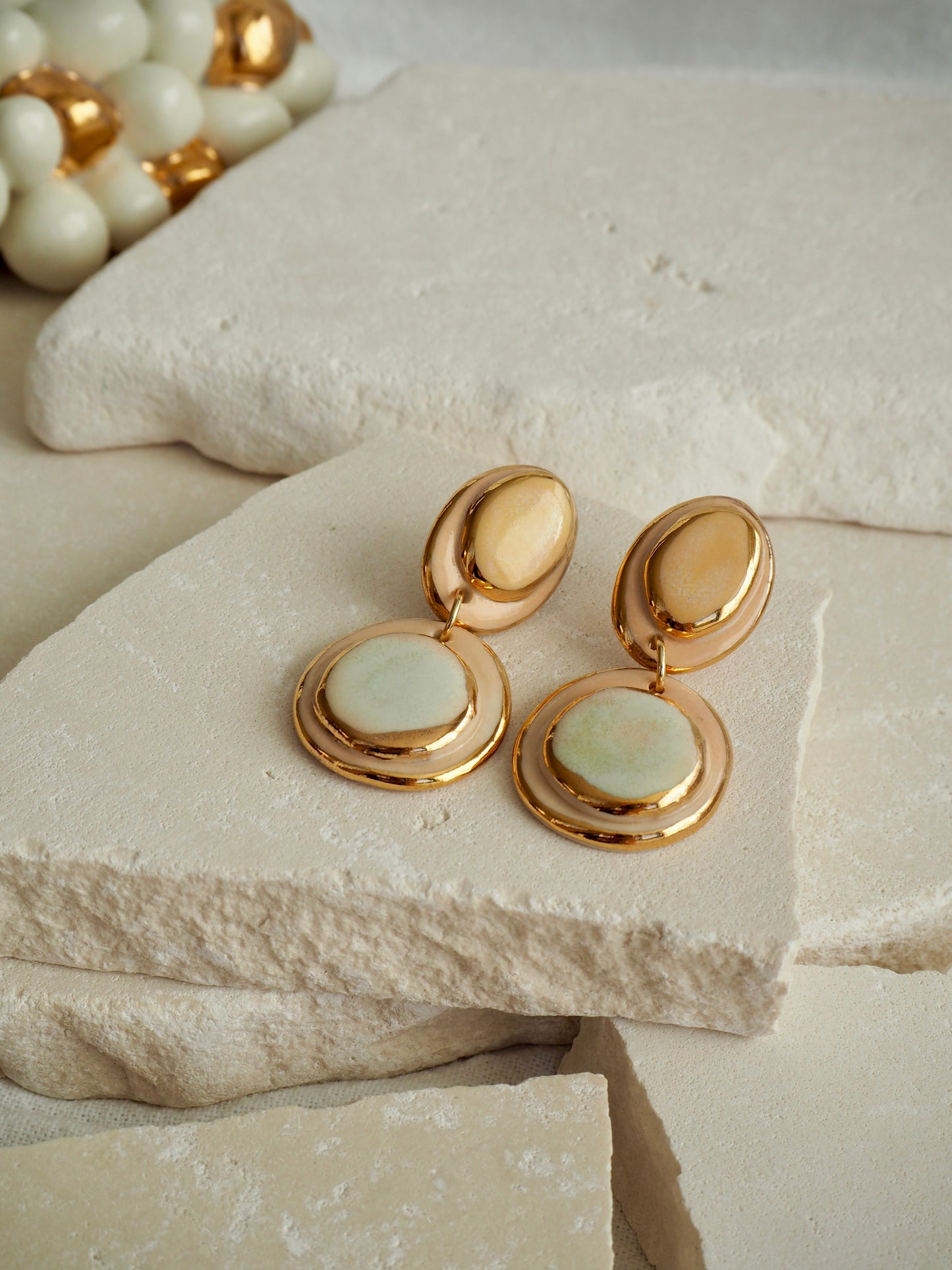 Femminilità Porcelain Earrings in Pale Lime and Mint Green coloured glossy glaze on Parchment underglaze with 24k Gold lustre textured rims