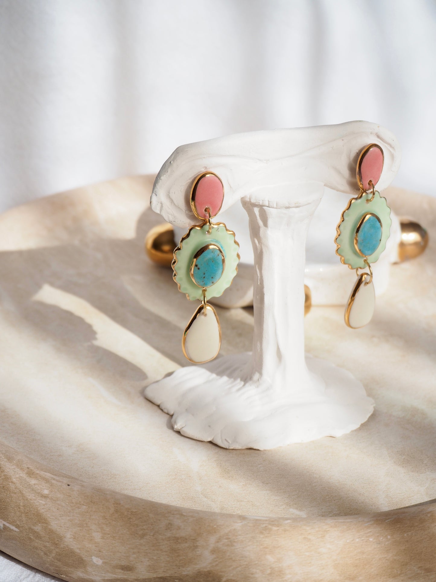 One of a kind Porcelain Earrings coloured with pink , aqua, light green and white glossy glazes with 24k lustre rims