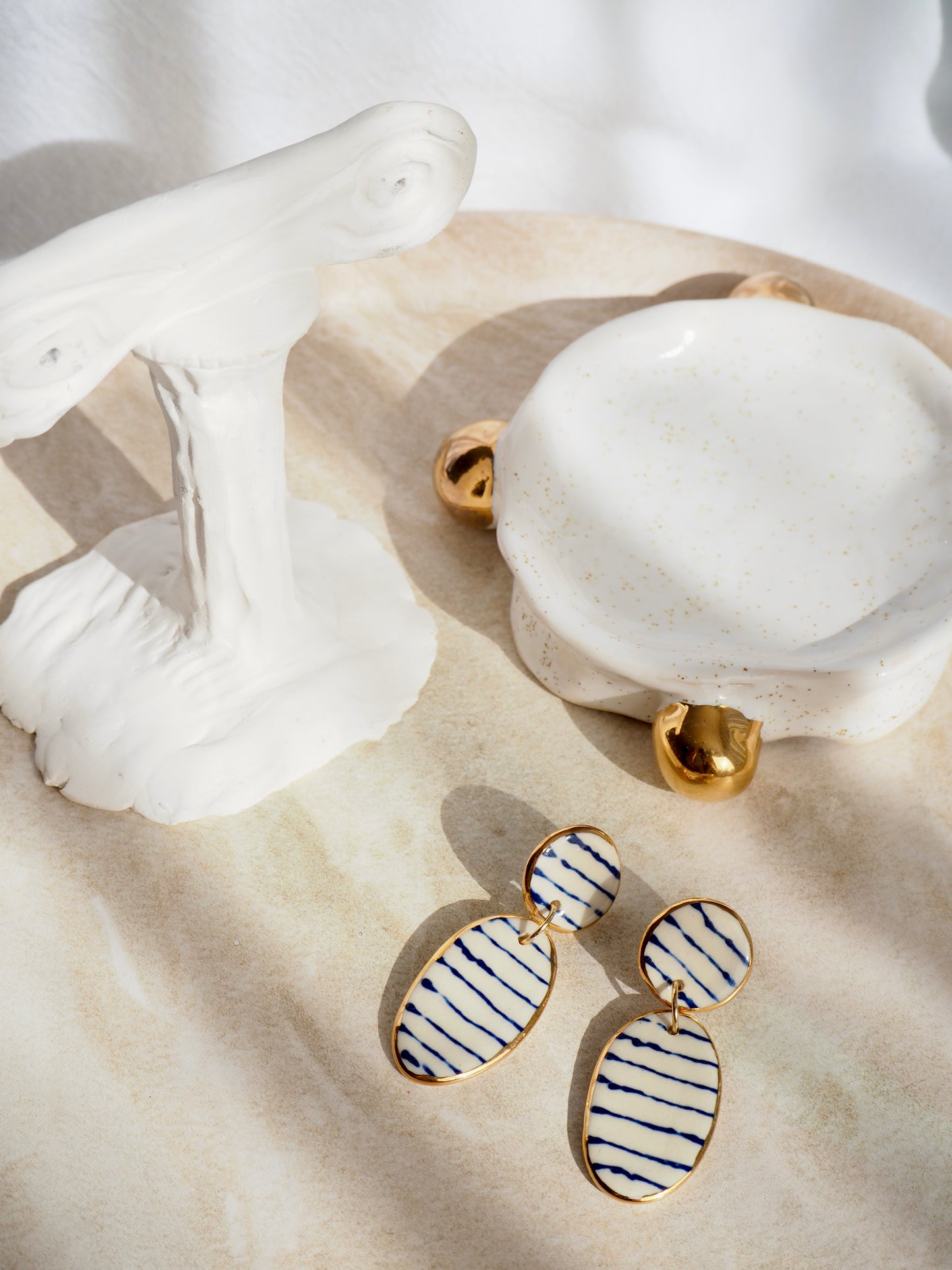 Stripes on Porcelain Earrings in “Royal Blue” ceramic stain under clear glaze for glossy look 24k gold rims