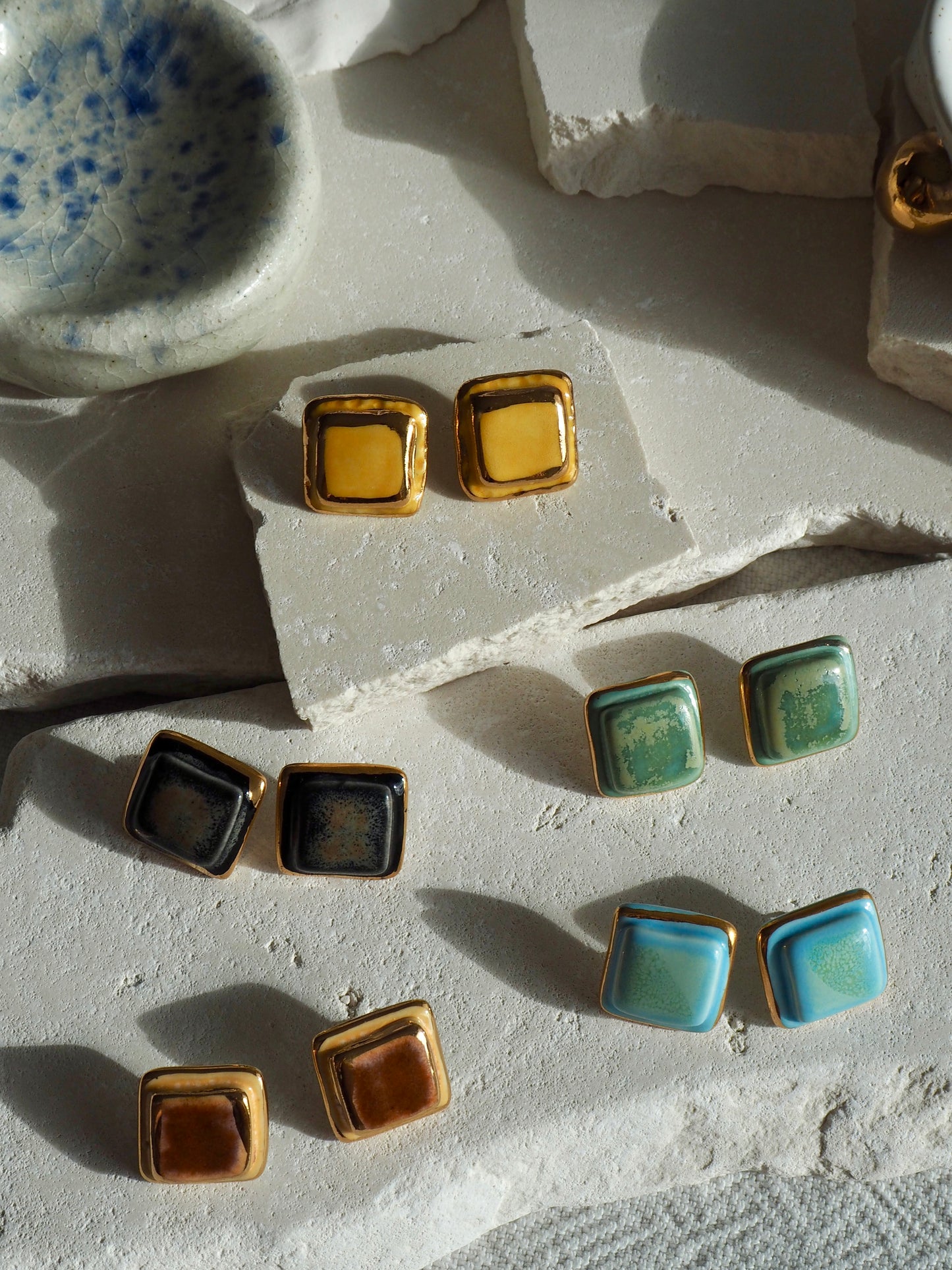 “il Quadrato” Medium Handmade Porcelain Studs coloured with “Black Galaxy” glossy glaze with 24k Gold lustre details