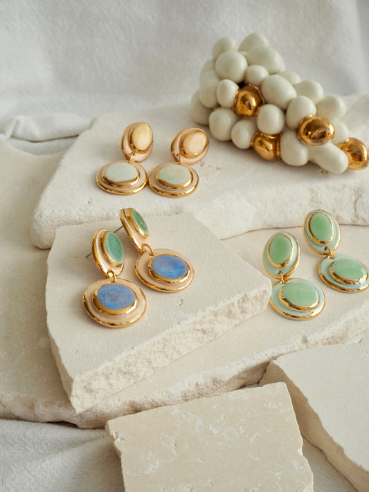 Femminilità Porcelain Earrings in Mint Green coloured glossy glaze on Parchment underglaze with 24k Gold lustre textured rims