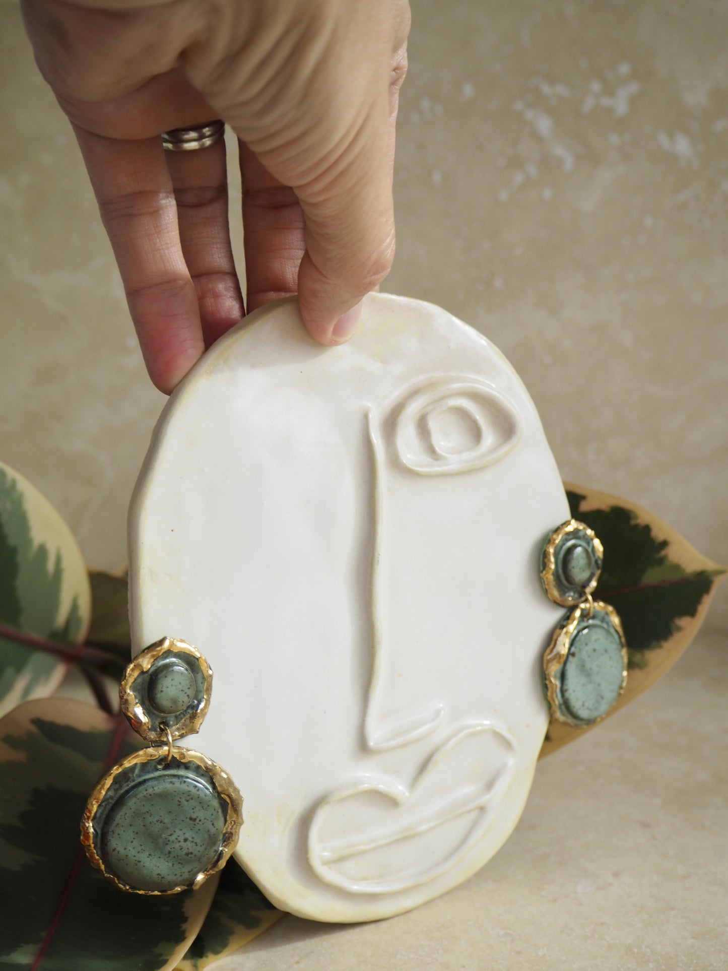 Femminilità Porcelain Earrings in a “green speckled ash” coloured glaze with 24k Gold lustre textured rims