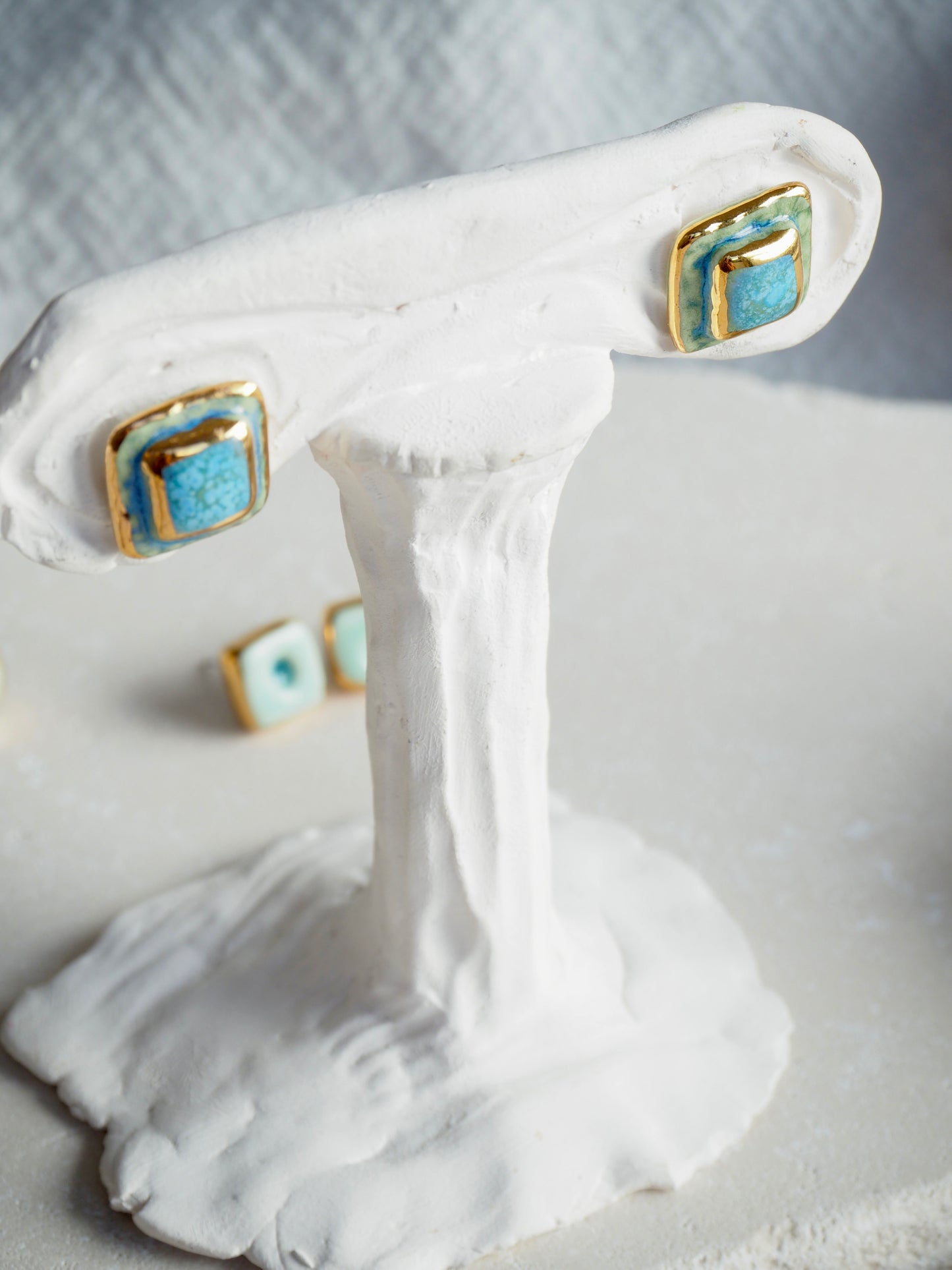 “il Quadrato” Small Handmade Porcelain Studs coloured with “Blues&Greens” glossy glazes with 24k Gold lustre details