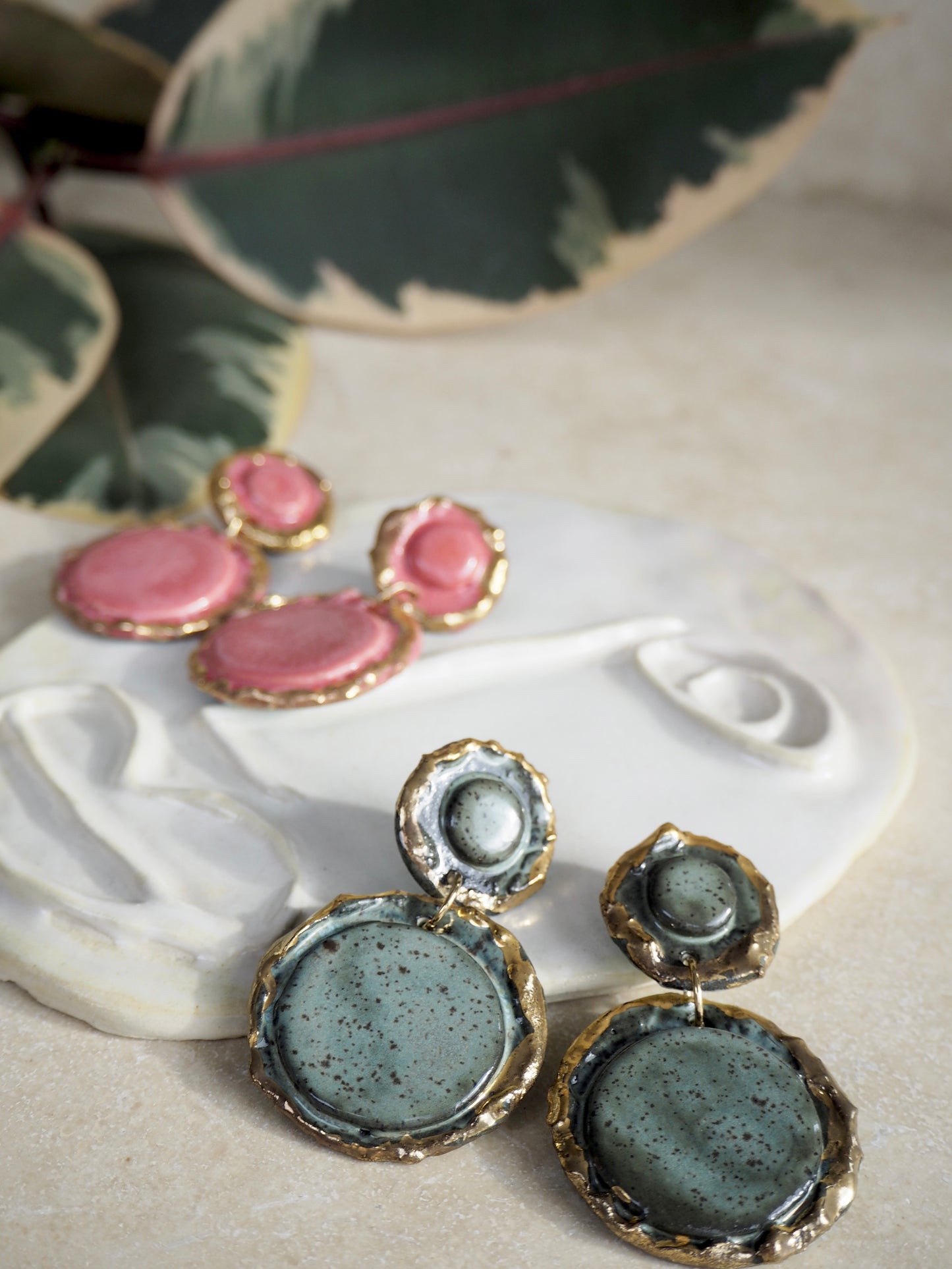 Femminilità Porcelain Earrings in a “green speckled ash” coloured glaze with 24k Gold lustre textured rims