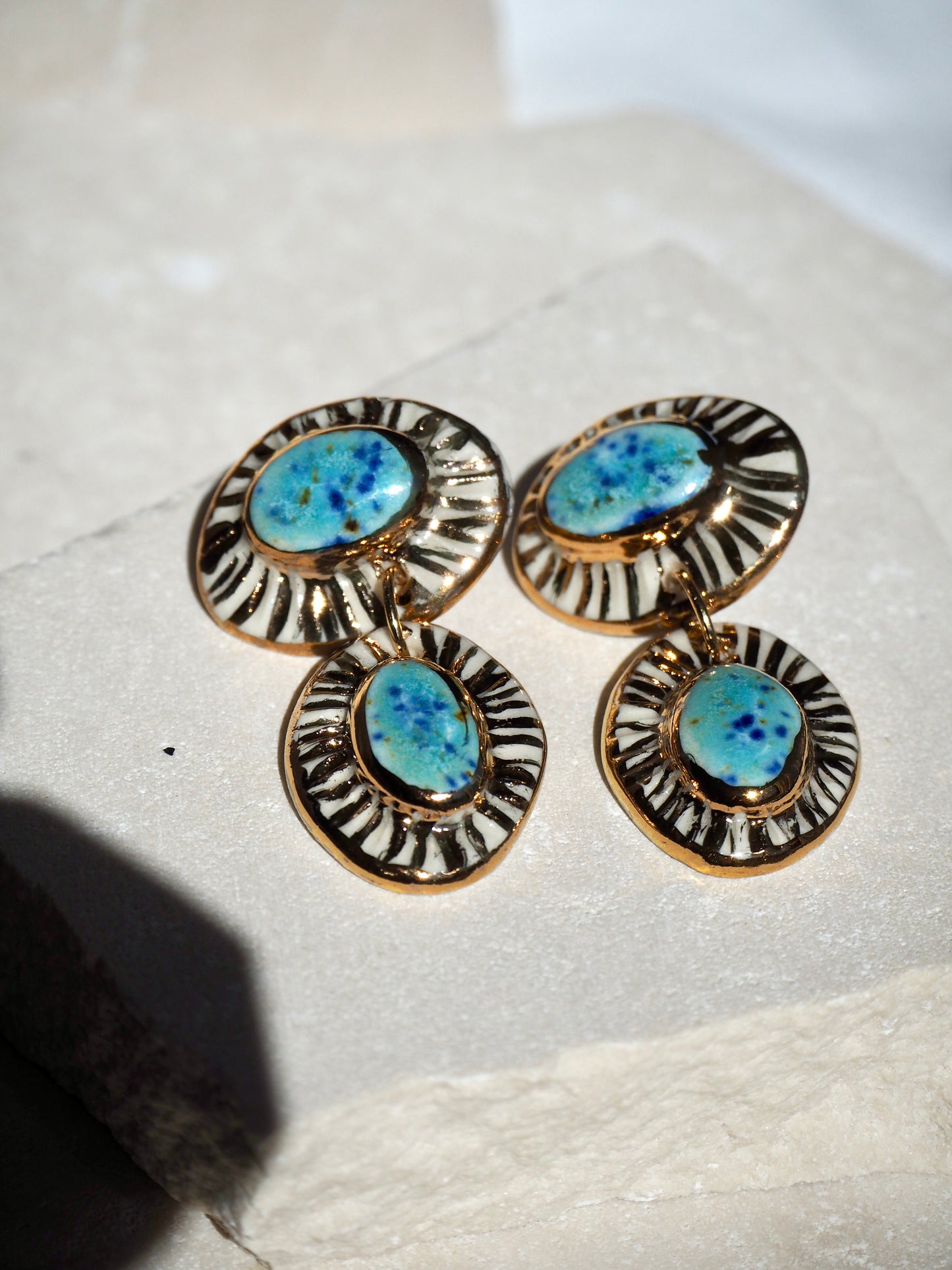 “Anima” Parchment underglaze & Blue Caprice coloured glaze with 24k gold lustre rays