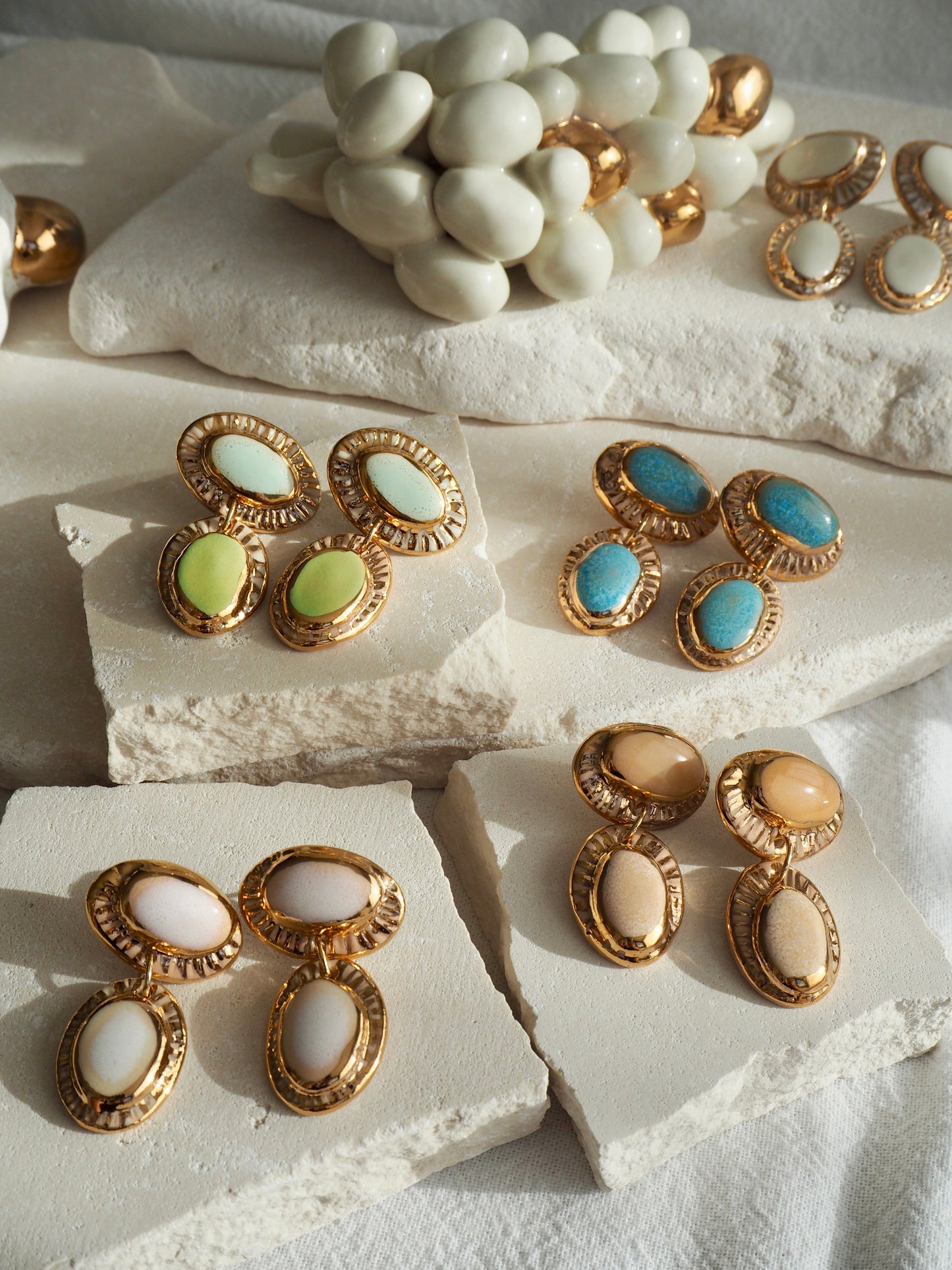 Coconut “Anima” Handmade Porcelain Earrings with Parchment underglaze under Faded White coloured glaze with 24k gold lustre rays