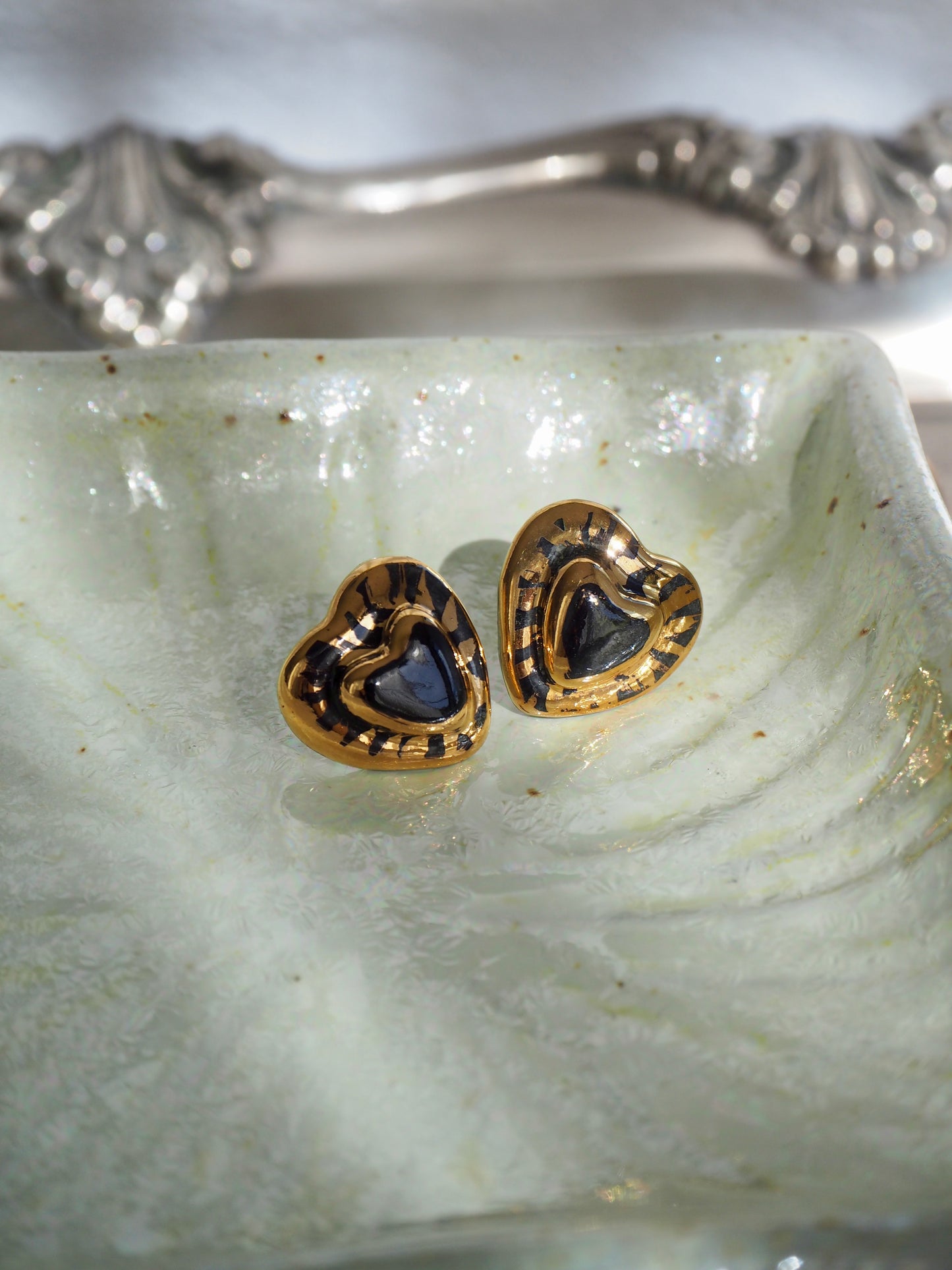 Small Handmade Porcelain Heart Stud coloured with “Black” glossy glaze with 24k Gold lustre rays