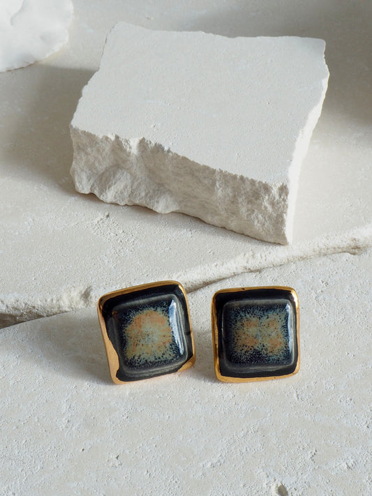 “il Quadrato” Medium Handmade Porcelain Studs coloured with “Black Galaxy” glossy glaze with 24k Gold lustre details