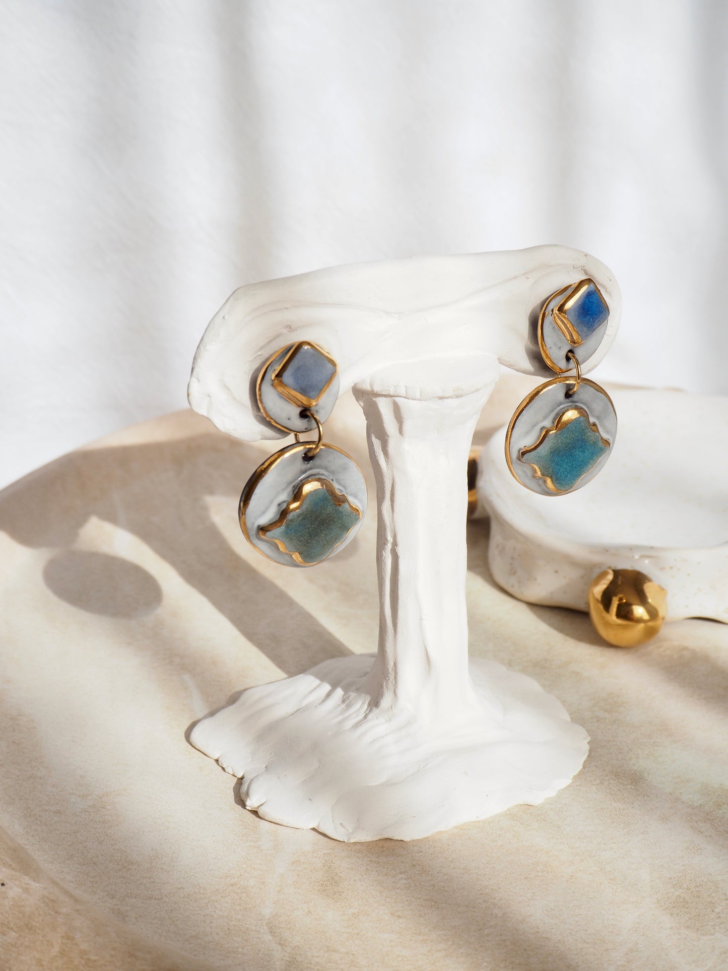 Pietra Collection handmade Black Clay Earrings coloured using green and blue glazes with 24k gold lustre details