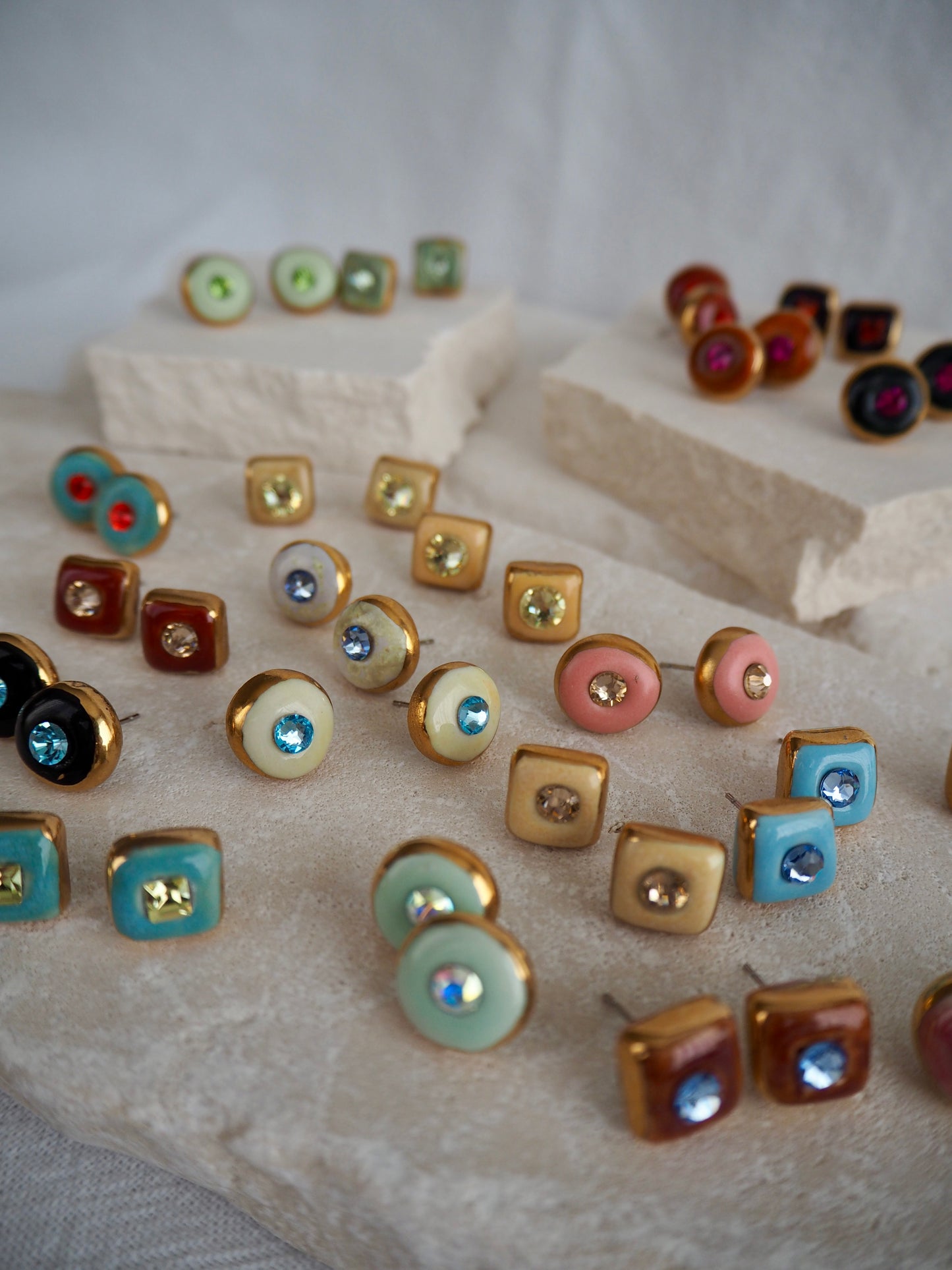 “Supernova” Light Blue Small Square Handmade Porcelain Studs with 24k Gold lustre rims and Swarovskis Crystal.