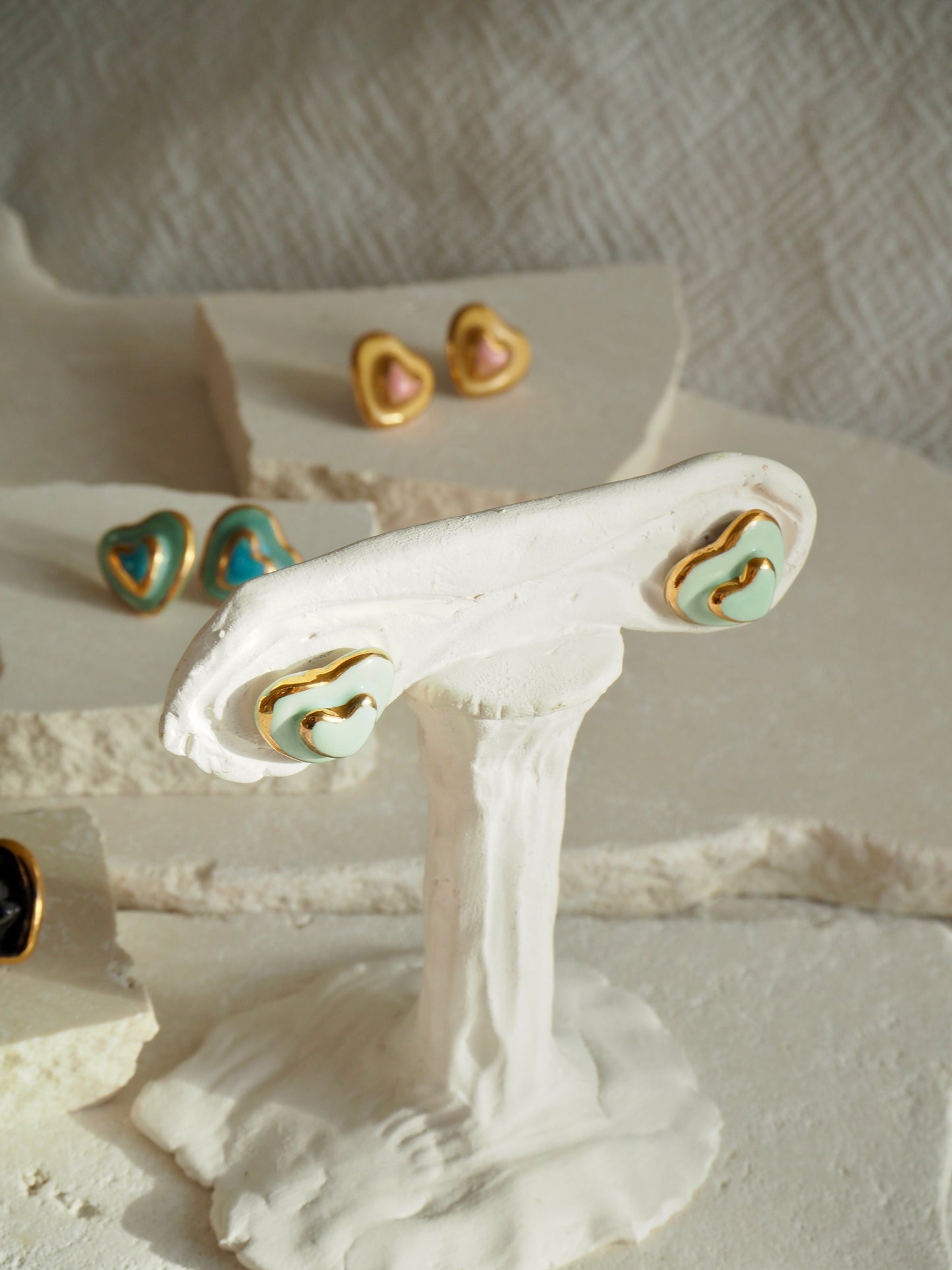 Small Handmade Porcelain Heart Stud coloured with “Light Sade” matt glaze with 24k Gold lustre details