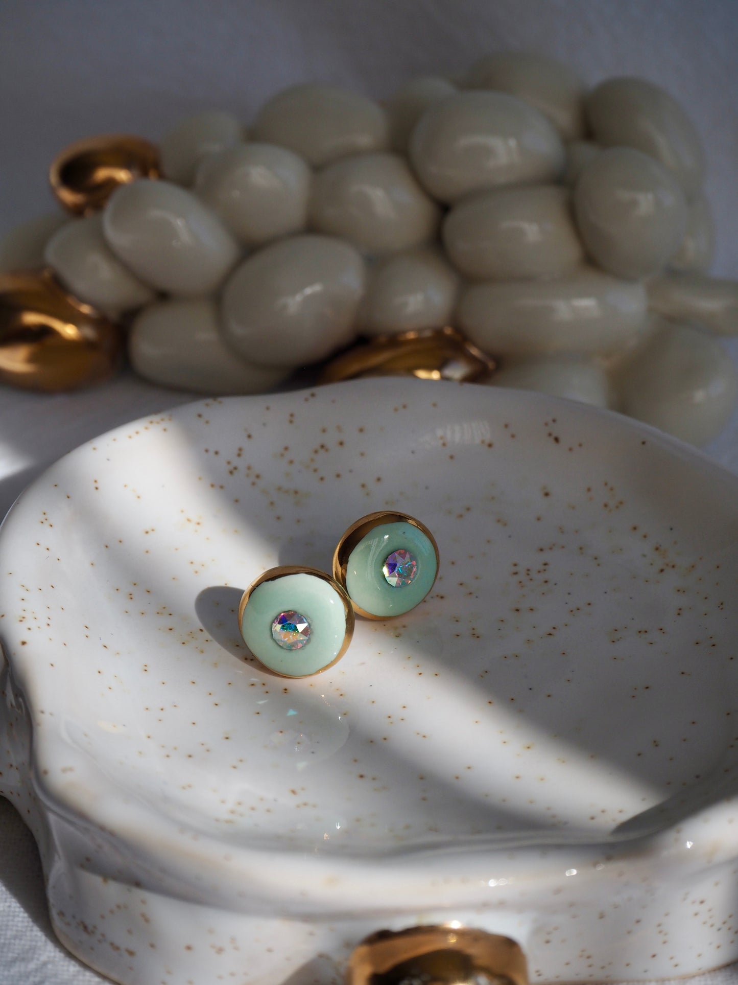 “Supernova” Light Green Small Handmade Porcelain Studs with 24k Gold lustre rims and “Aurora Borealis” Swarovskis Crystal.