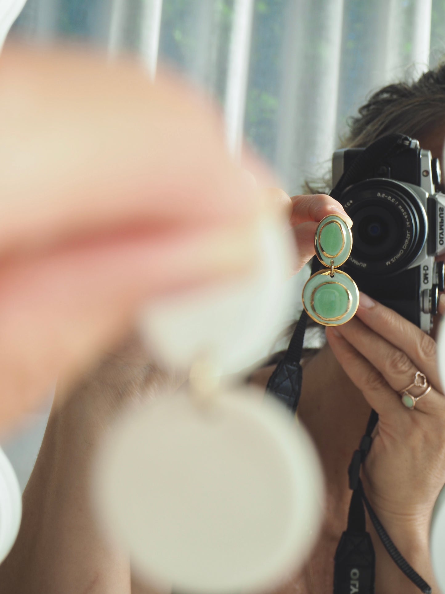 Femminilità Porcelain Earrings in Mint Green coloured glossy glaze on Parchment underglaze with 24k Gold lustre textured rims