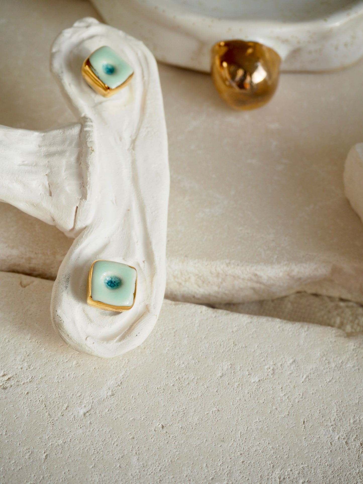 “il Quadrato” Small Handmade Porcelain Studs coloured with Shades of Aqua glossy glaze with 24k Gold lustre details