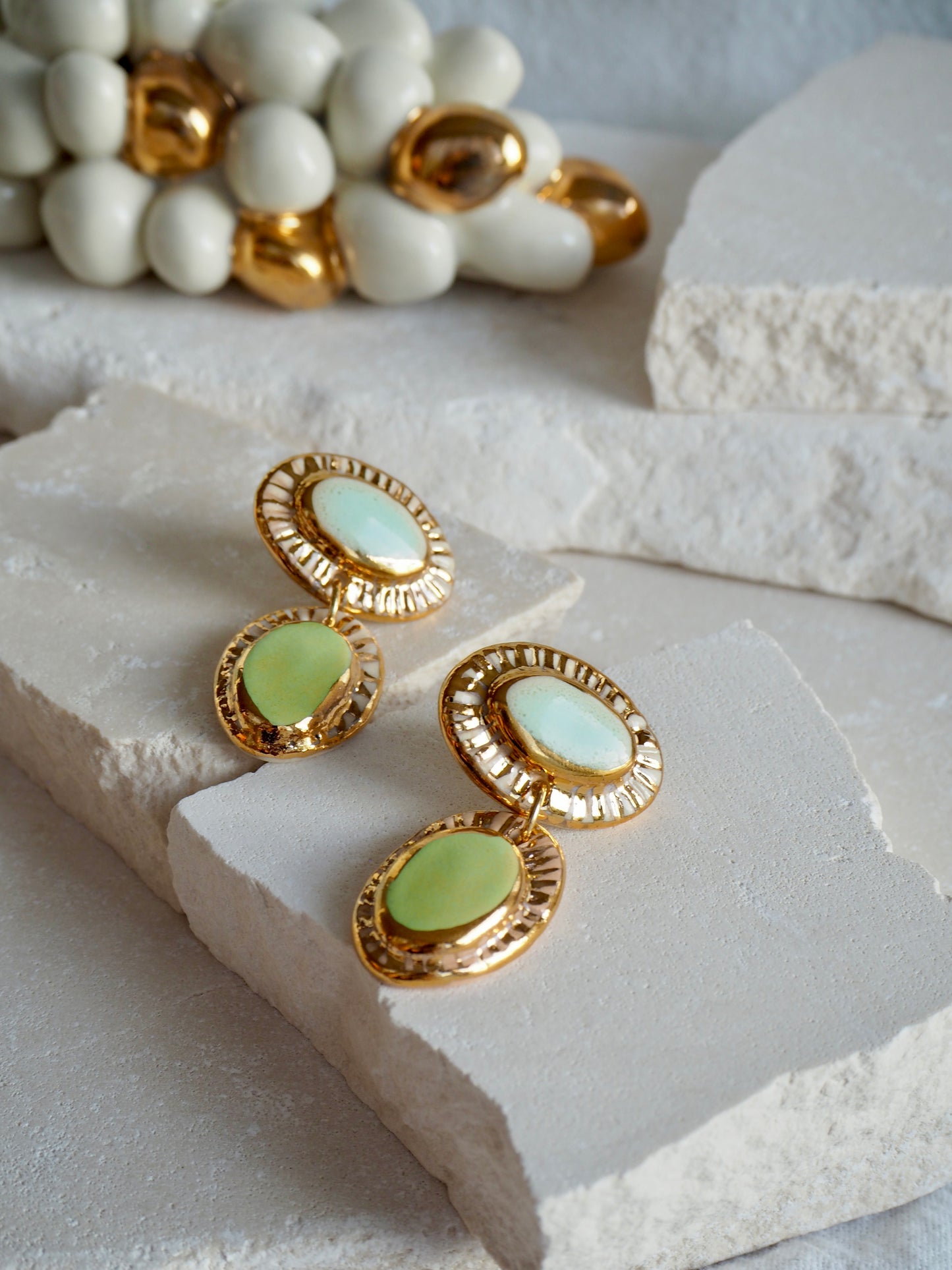 Hideaway Bay “Anima” Handmade Porcelain Earrings with Parchment underglaze and Green & Pale blue glazes with 24k gold lustre rays
