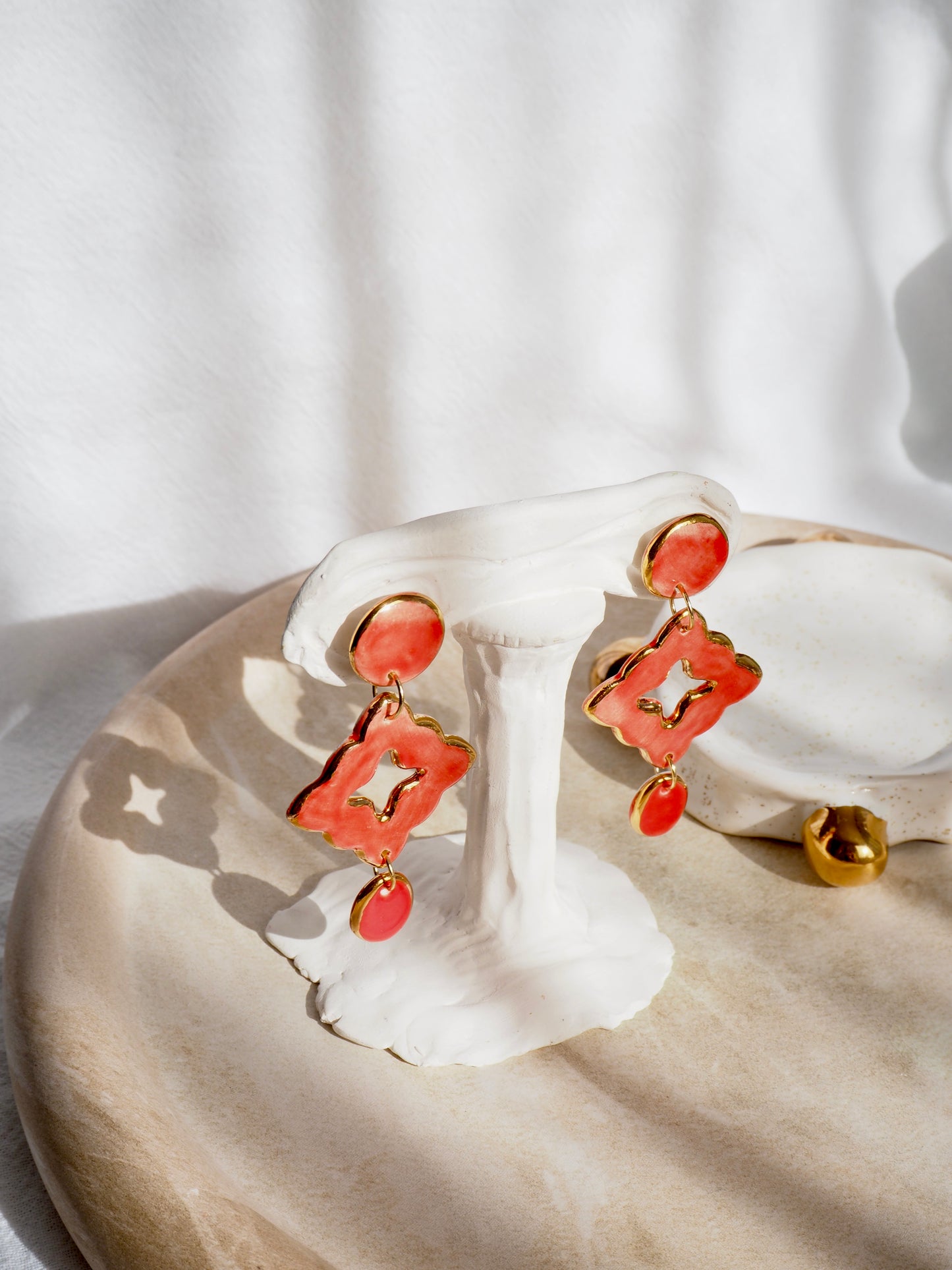 “A Feast for your Eyes” Handmade Porcelain Earrings in Warm Red  coloured glaze with 24k gold lustre details.