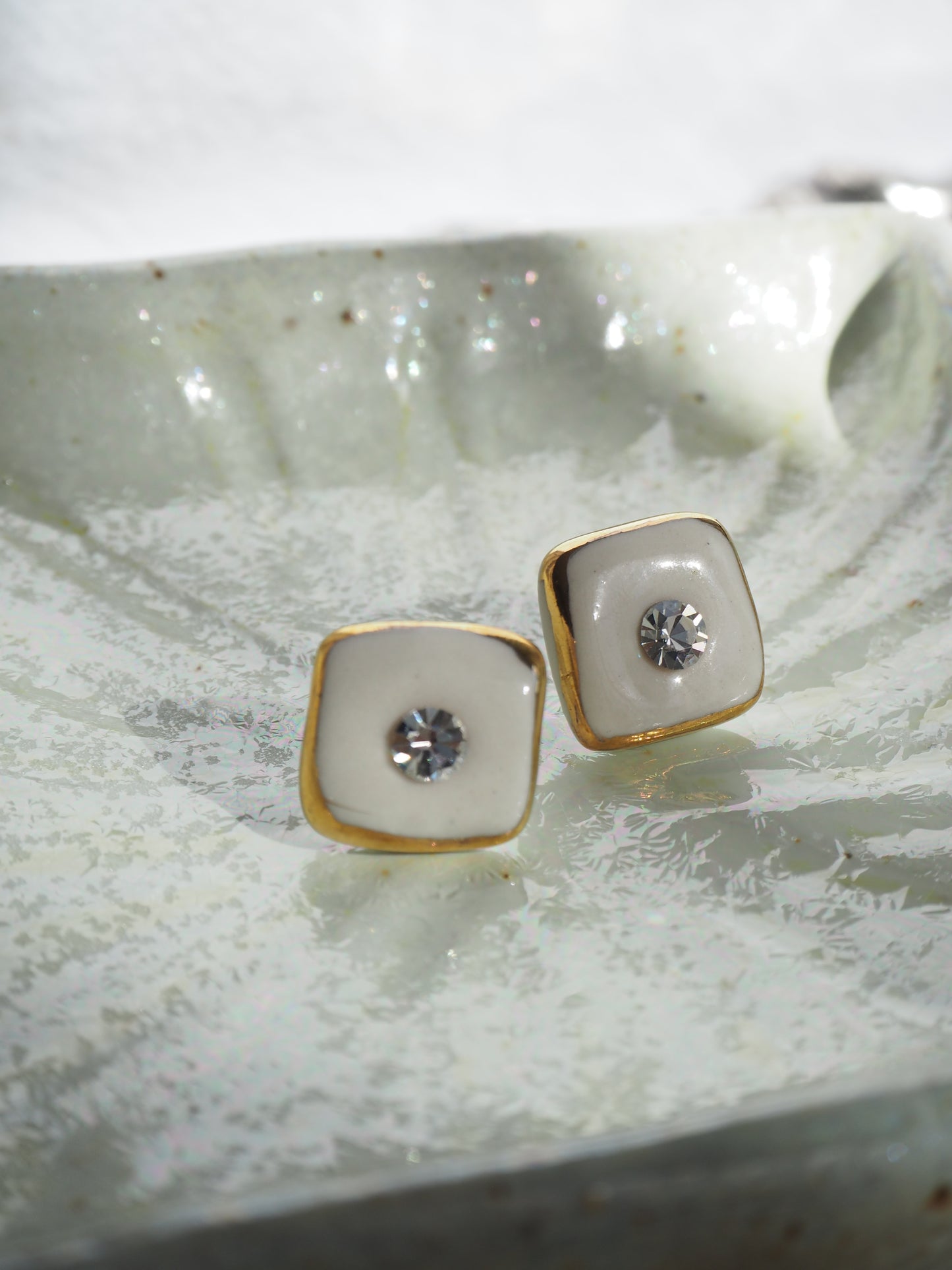 “Bigger Supernova” White Large Handmade Porcelain Studs with 24k Gold lustre rims and an Swarovskis Crystal