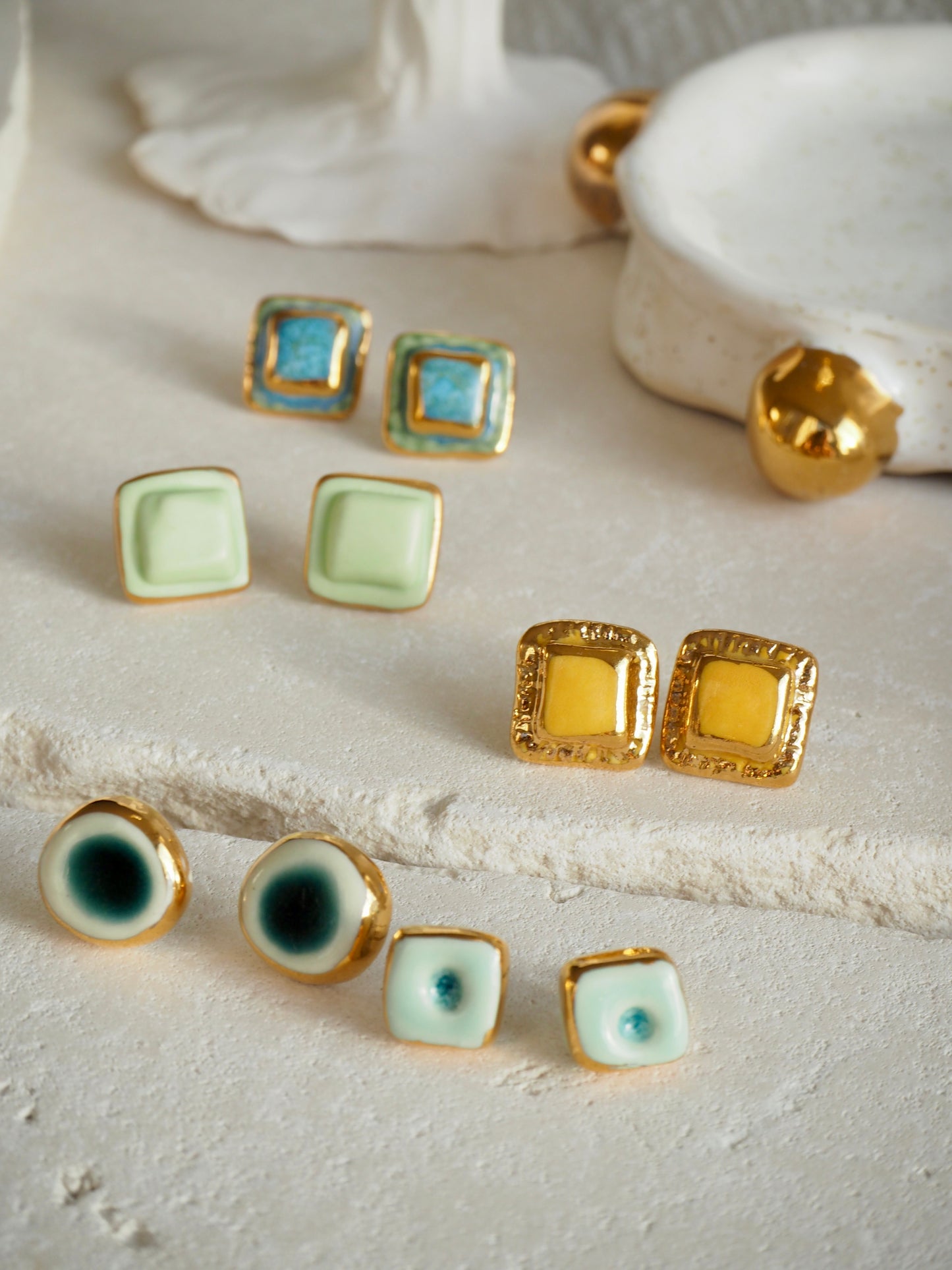 “il Quadrato” Small Handmade Porcelain Studs coloured with Shades of Aqua glossy glaze with 24k Gold lustre details