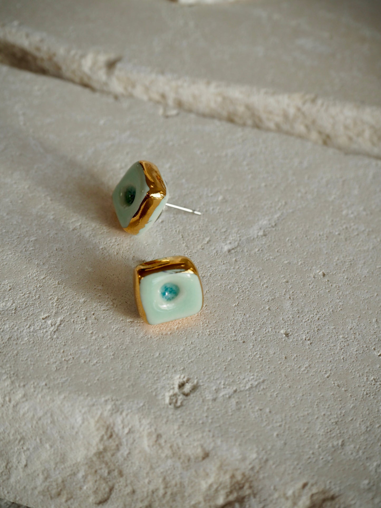 “il Quadrato” Small Handmade Porcelain Studs coloured with Shades of Aqua glossy glaze with 24k Gold lustre details