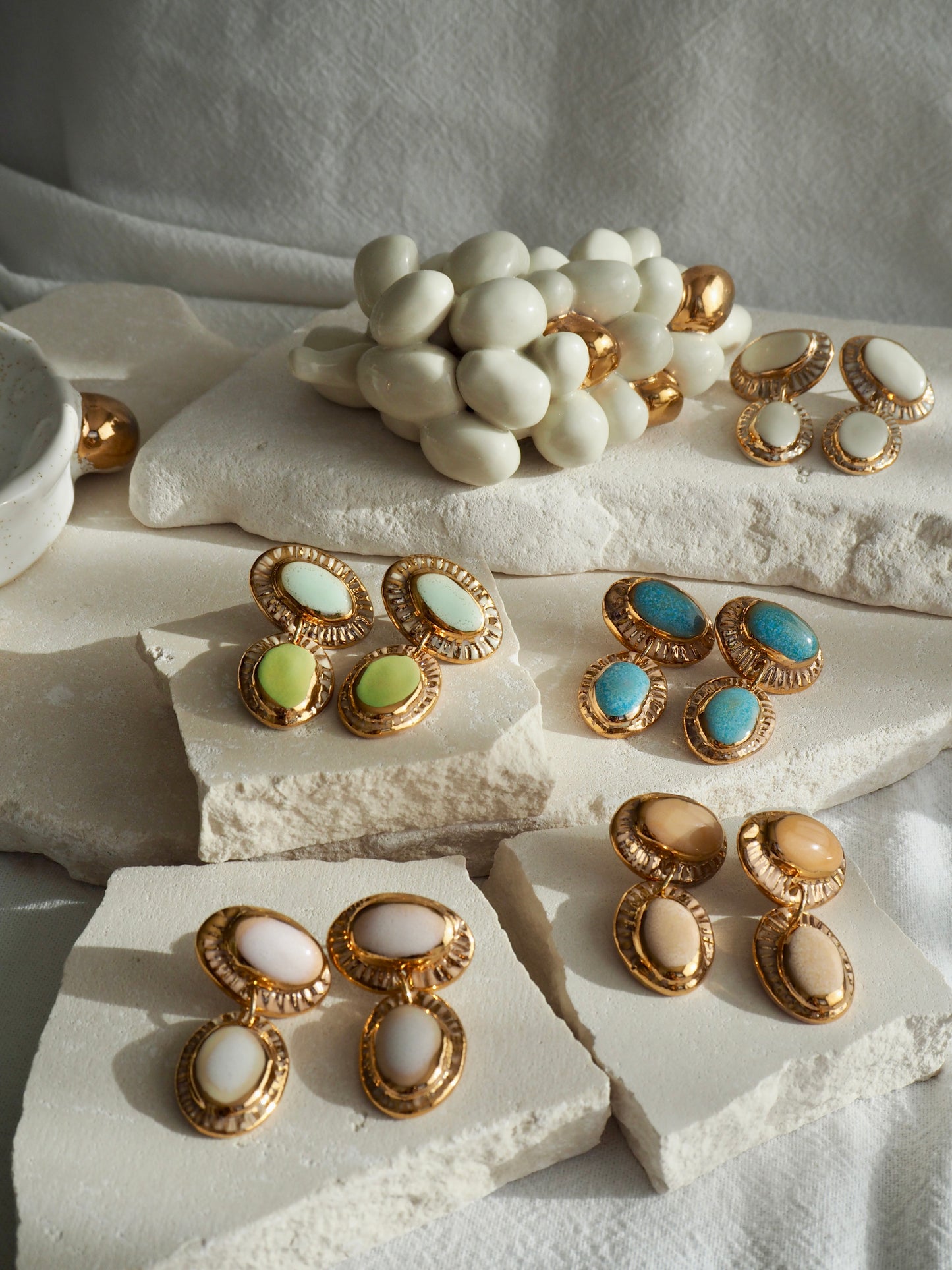 Coconut “Anima” Handmade Porcelain Earrings with Parchment underglaze under Faded White coloured glaze with 24k gold lustre rays