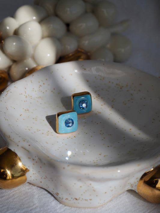“Supernova” Light Blue Small Square Handmade Porcelain Studs with 24k Gold lustre rims and Swarovskis Crystal.