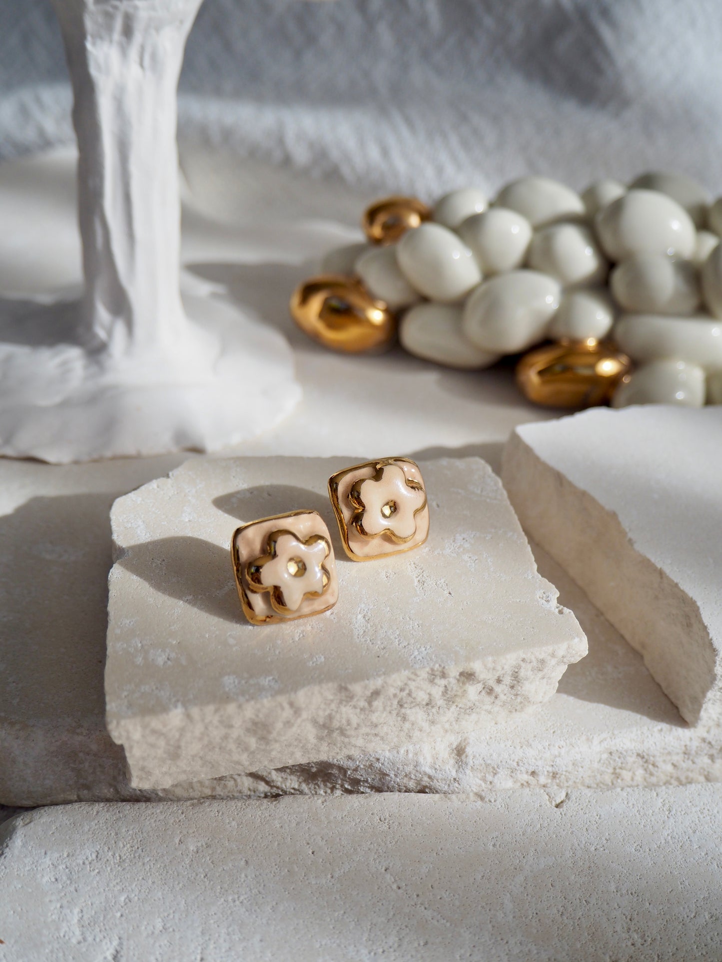 “il Quadrato’s Fiore Small Handmade Porcelain Studs coloured with “Light Beige” glossy glaze with 24k Gold lustre details