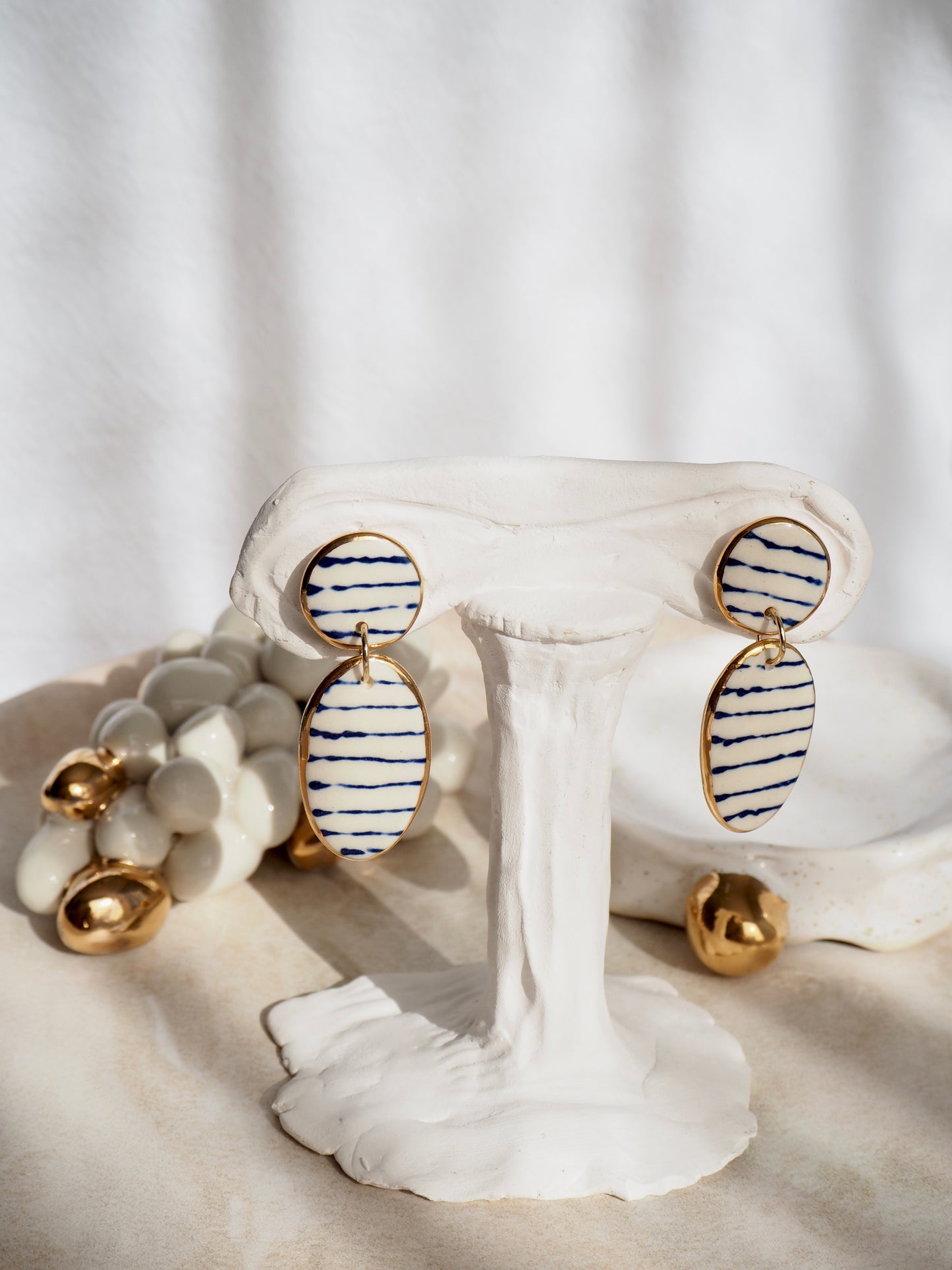 Stripes on Porcelain Earrings in “Royal Blue” ceramic stain under clear glaze for glossy look 24k gold rims