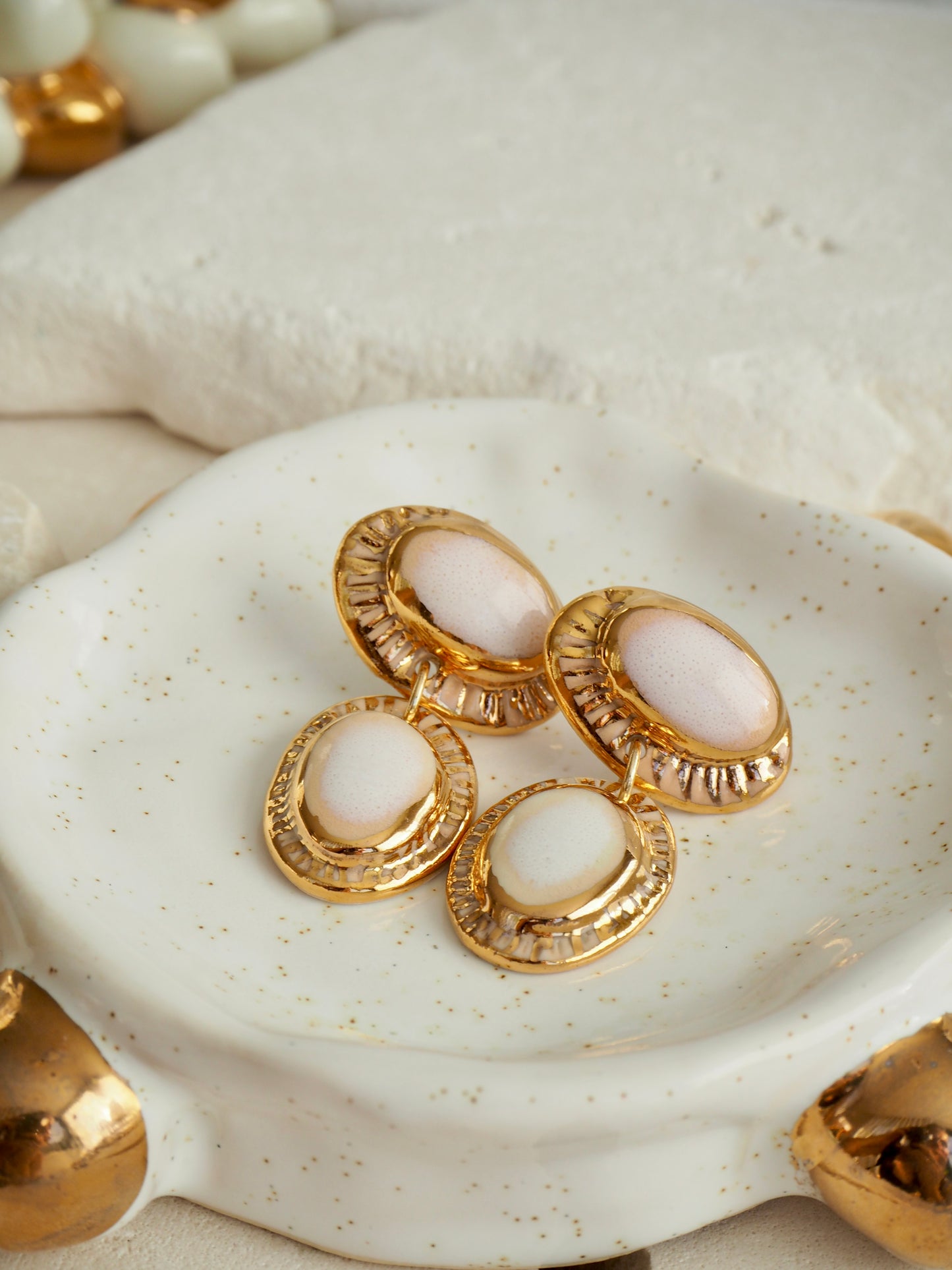 Coconut “Anima” Handmade Porcelain Earrings with Parchment underglaze under Faded White coloured glaze with 24k gold lustre rays
