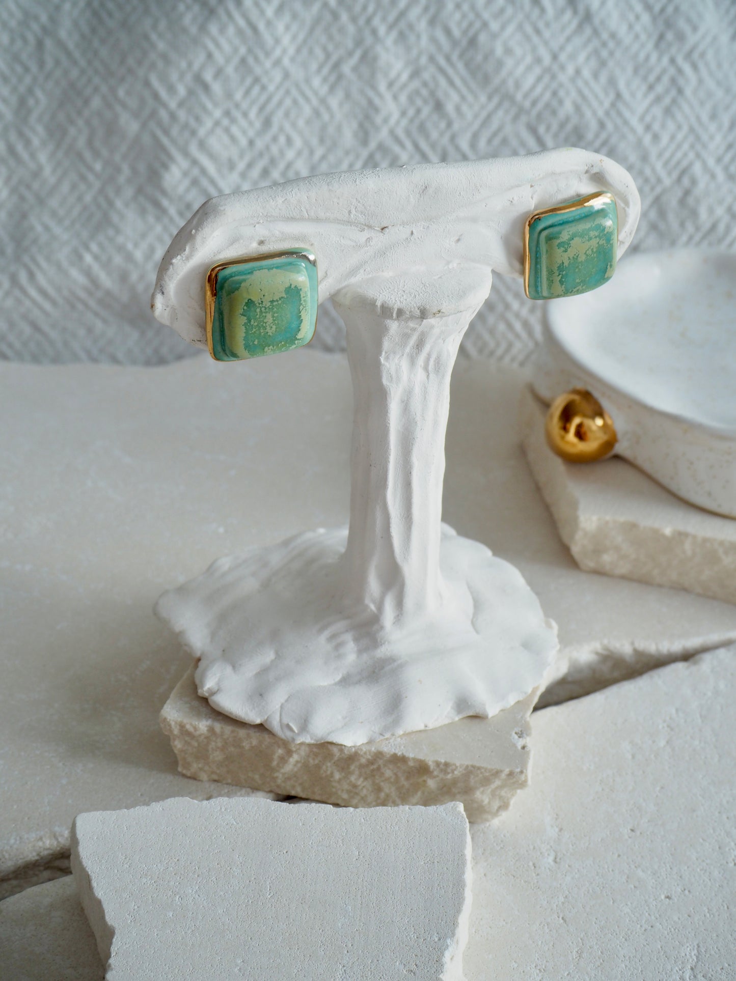 “il Quadrato” Medium Handmade Porcelain Studs coloured with “Pebble Green” glossy glaze with 24k Gold lustre details