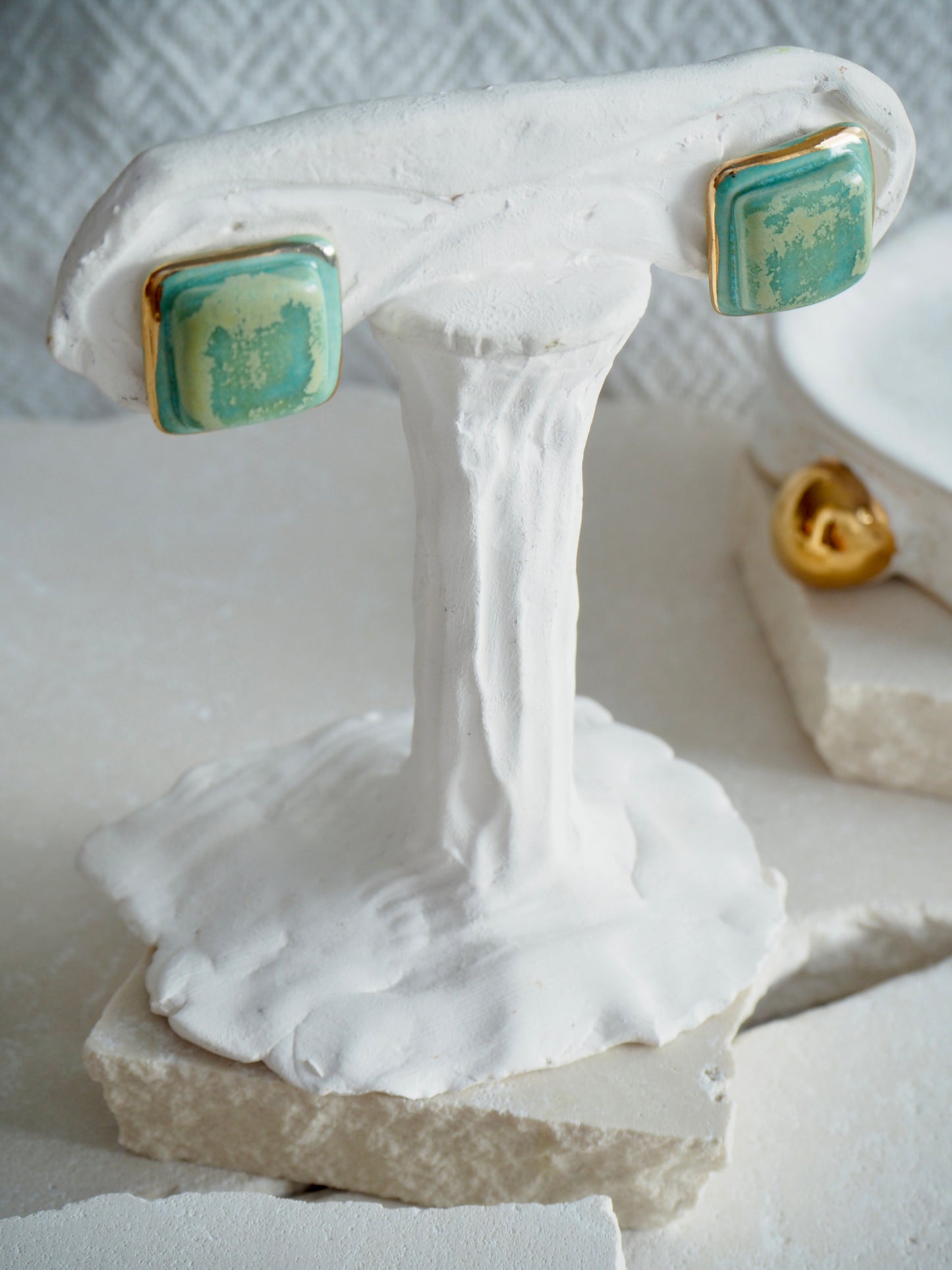 “il Quadrato” Medium Handmade Porcelain Studs coloured with “Pebble Green” glossy glaze with 24k Gold lustre details