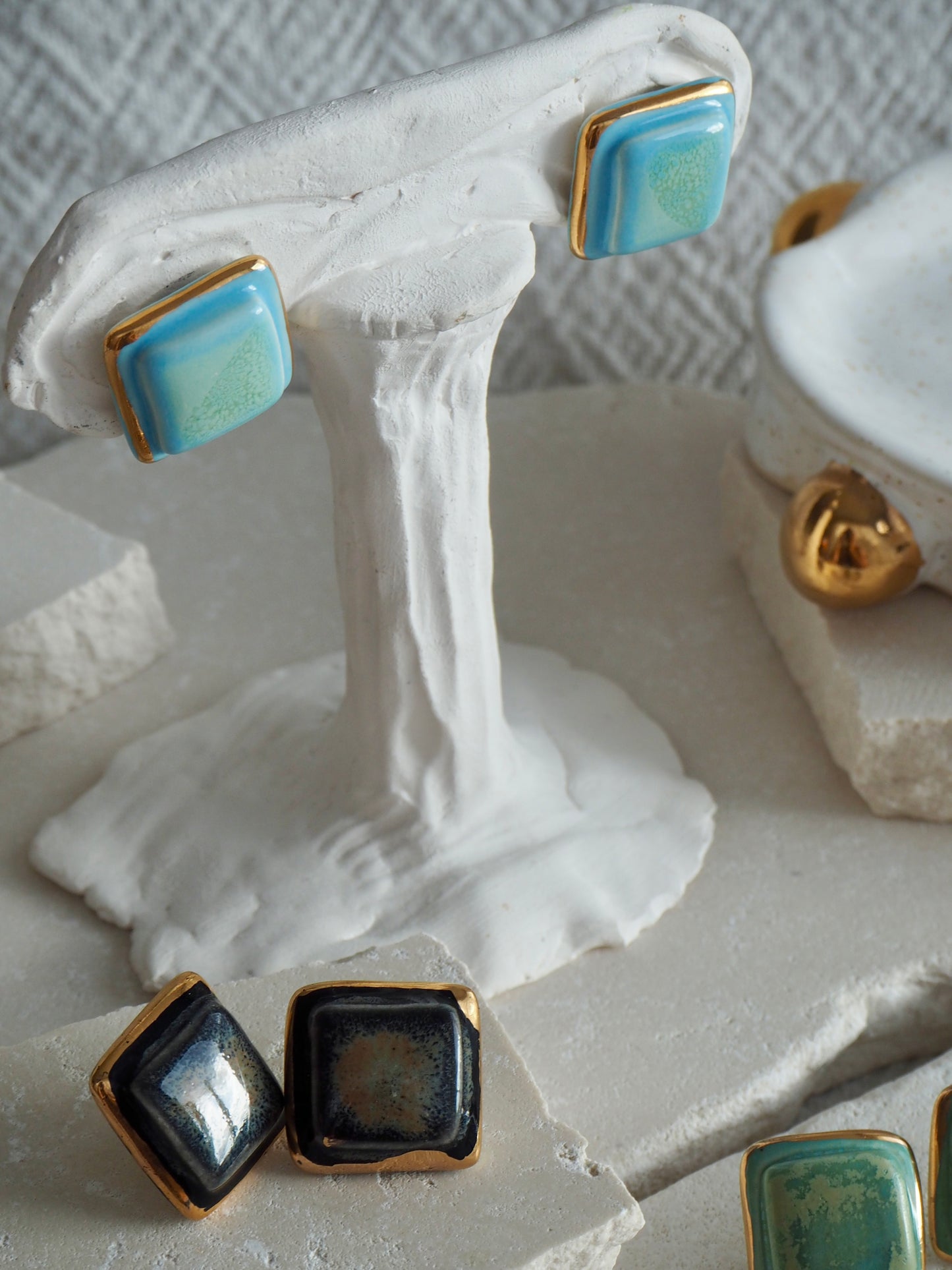 “il Quadrato” Medium Handmade Porcelain Studs coloured with “Black Galaxy” glossy glaze with 24k Gold lustre details