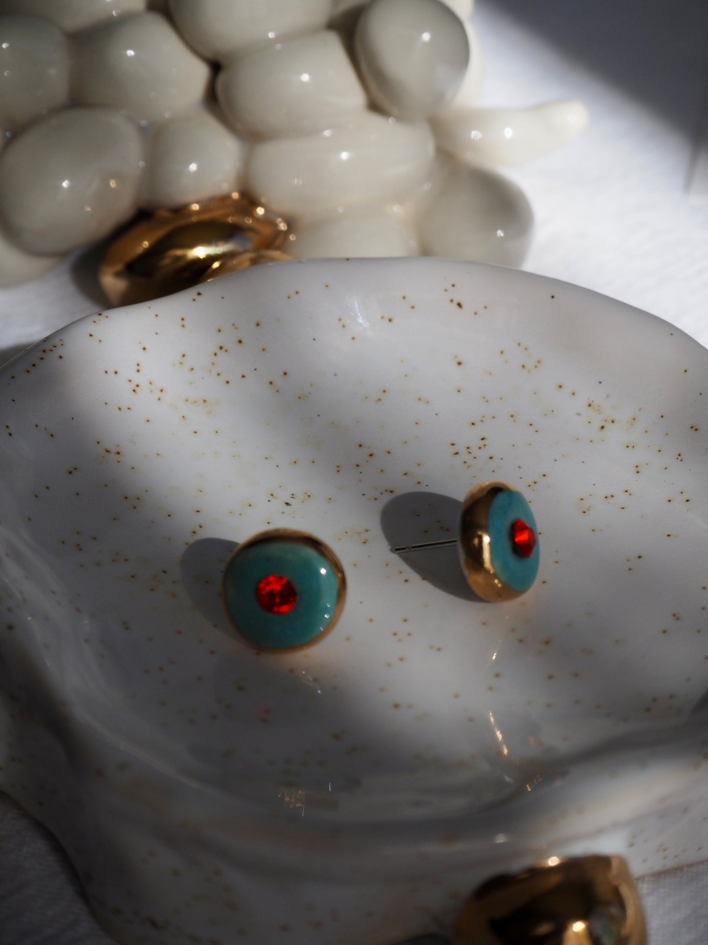 “Supernova” Aqua Green Small Handmade Porcelain Studs with 24k Gold lustre rims and Swarovskis Crystal.