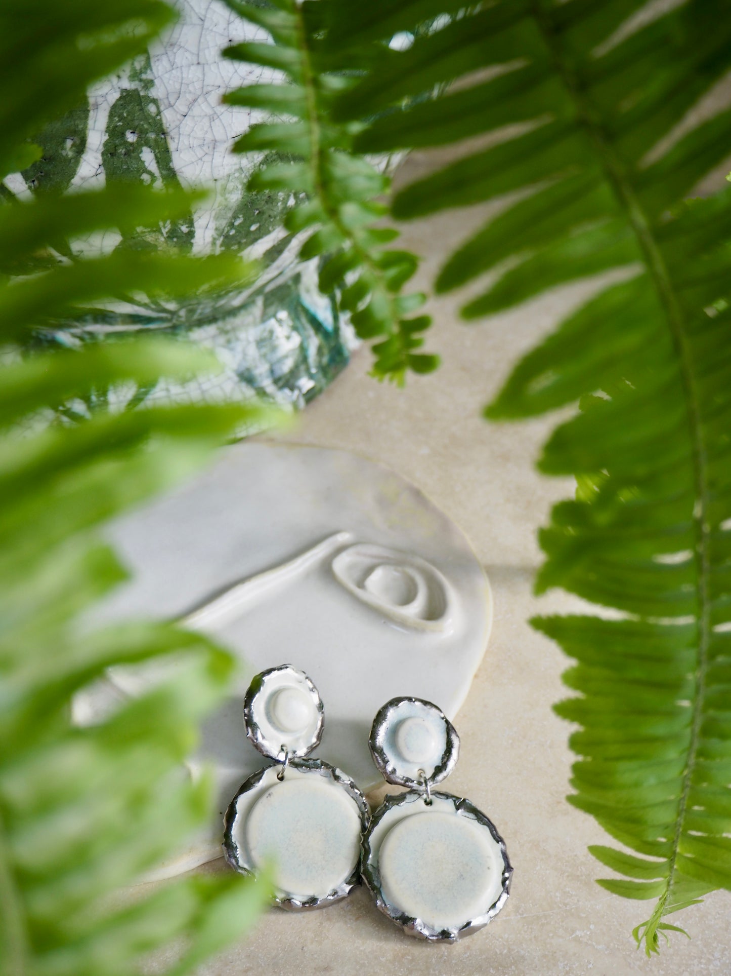 Femminilità Porcelain Earrings in “Snow” coloured glaze with Platinum lustre textured rims in a matte finish