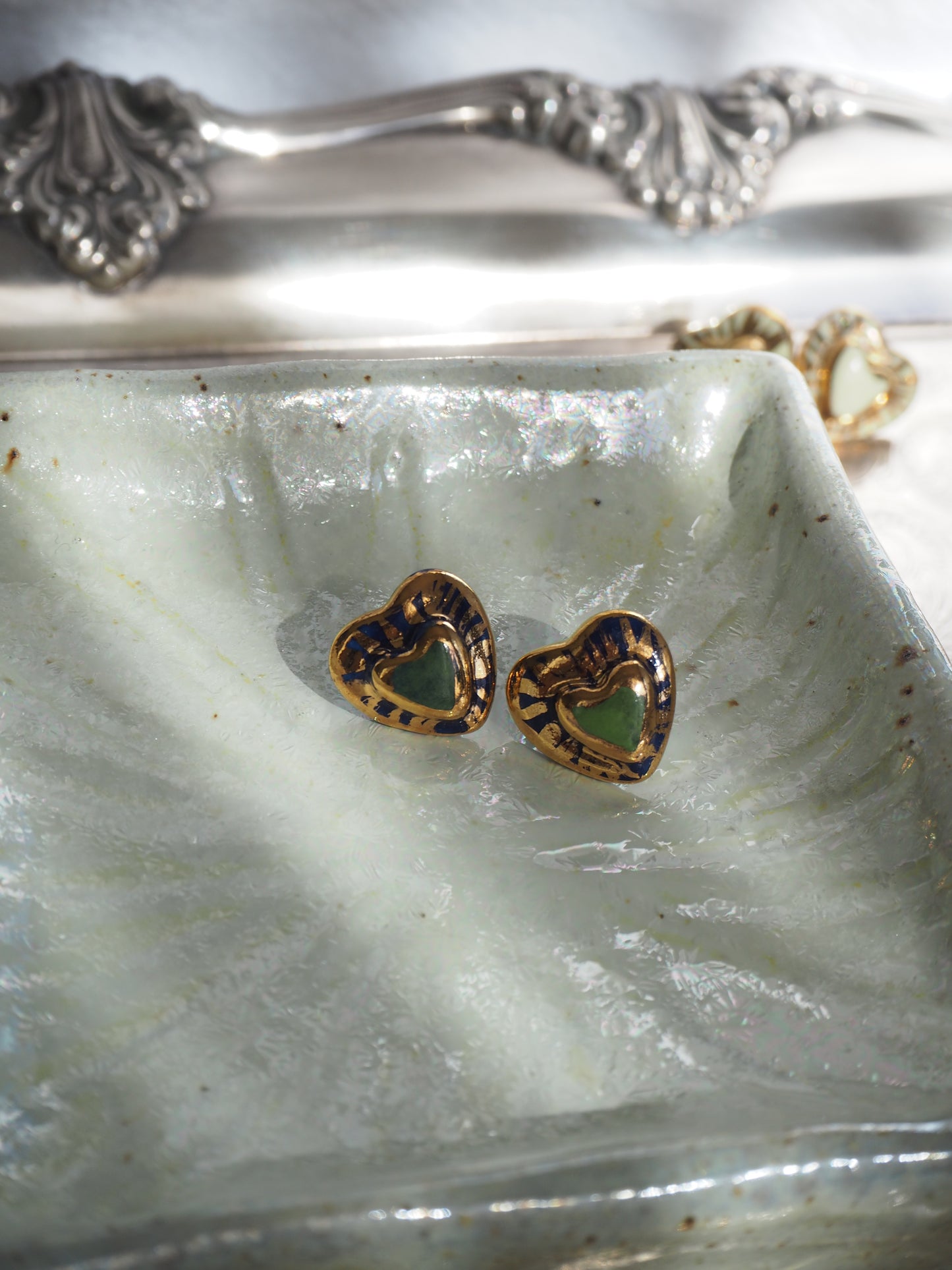 Small Handmade Porcelain Heart Stud coloured with “Dark Green and Blue” underglazes covered by glossy clear glaze with 24k Gold lustre rays