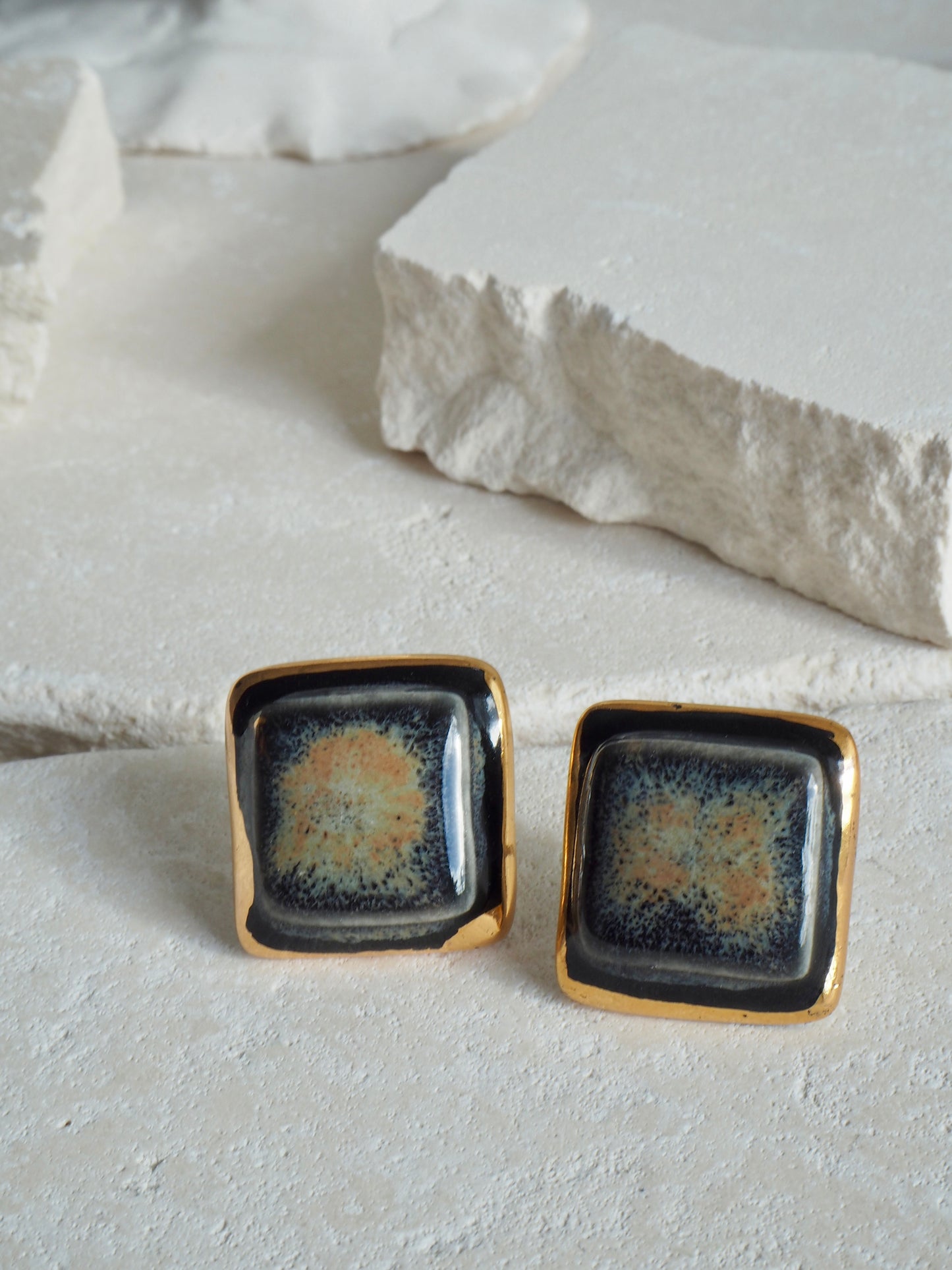 “il Quadrato” Medium Handmade Porcelain Studs coloured with “Black Galaxy” glossy glaze with 24k Gold lustre details