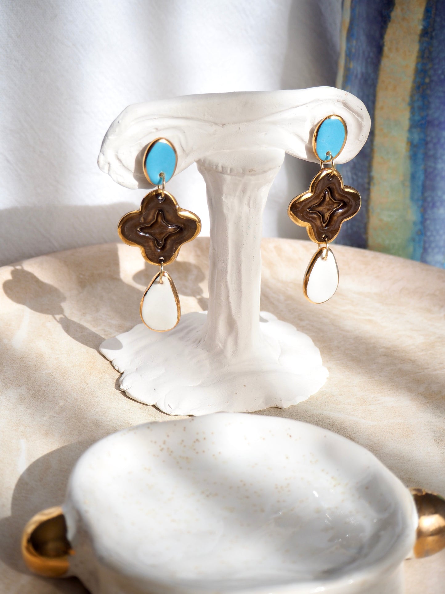 “A Feast for your Eyes” Handmade Porcelain Earrings in Blue, Brown and White glossy coloured glazes with 24k gold lustre details.