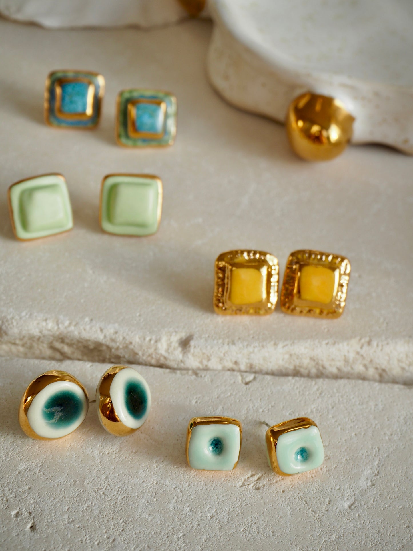“il Quadrato” Small Handmade Porcelain Studs coloured with Shades of Aqua glossy glaze with 24k Gold lustre details