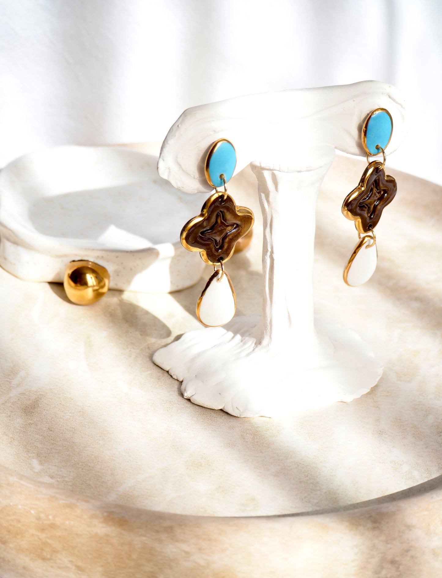 “A Feast for your Eyes” Handmade Porcelain Earrings in Blue, Brown and White glossy coloured glazes with 24k gold lustre details.