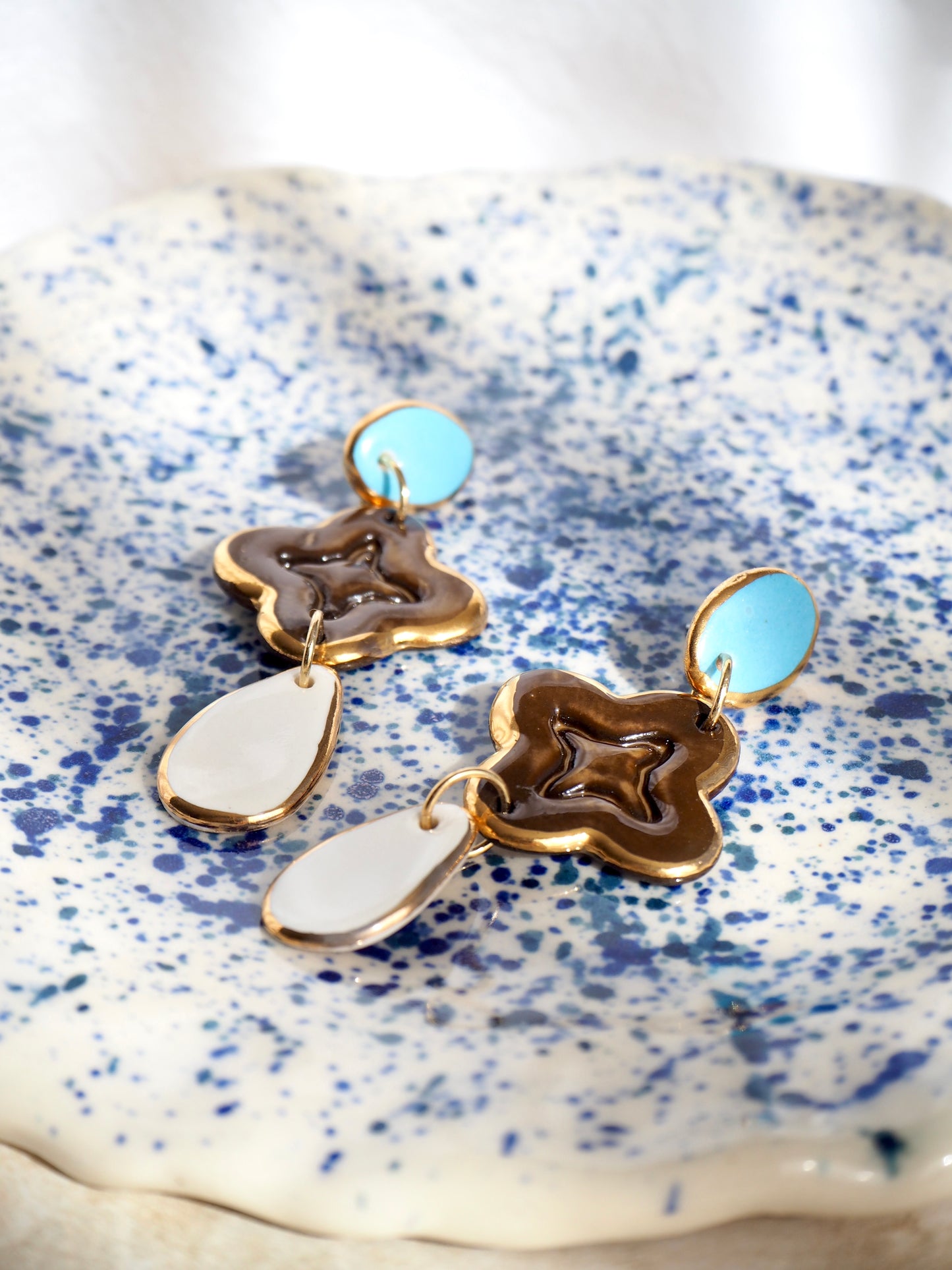 “A Feast for your Eyes” Handmade Porcelain Earrings in Blue, Brown and White glossy coloured glazes with 24k gold lustre details.