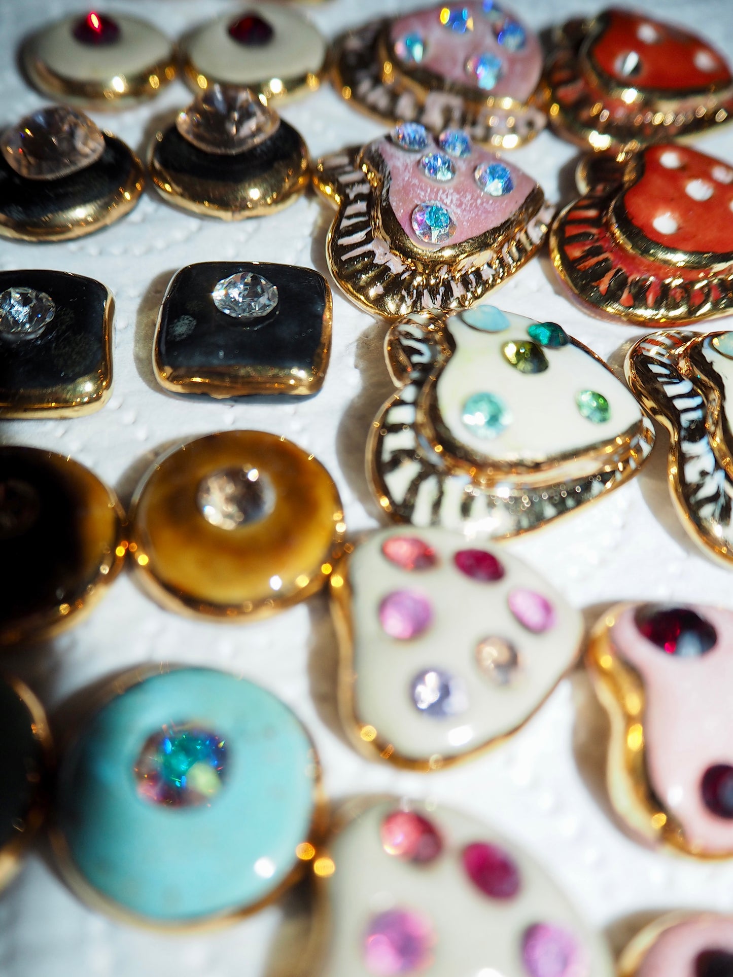 “Bigger Supernova” Speckled Black Large Handmade Porcelain Studs with 24k Gold lustre rims and an Swarovskis Crystal